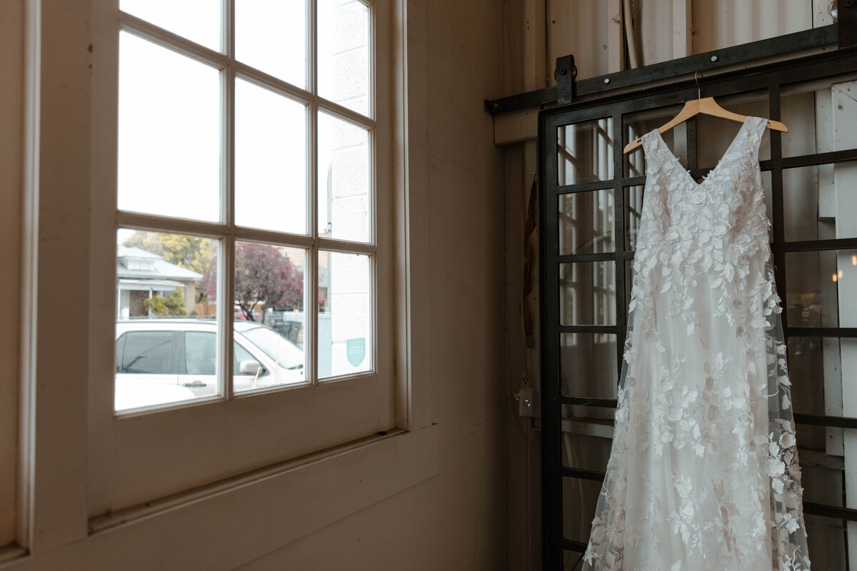 Bride's Dress Hanging in Window