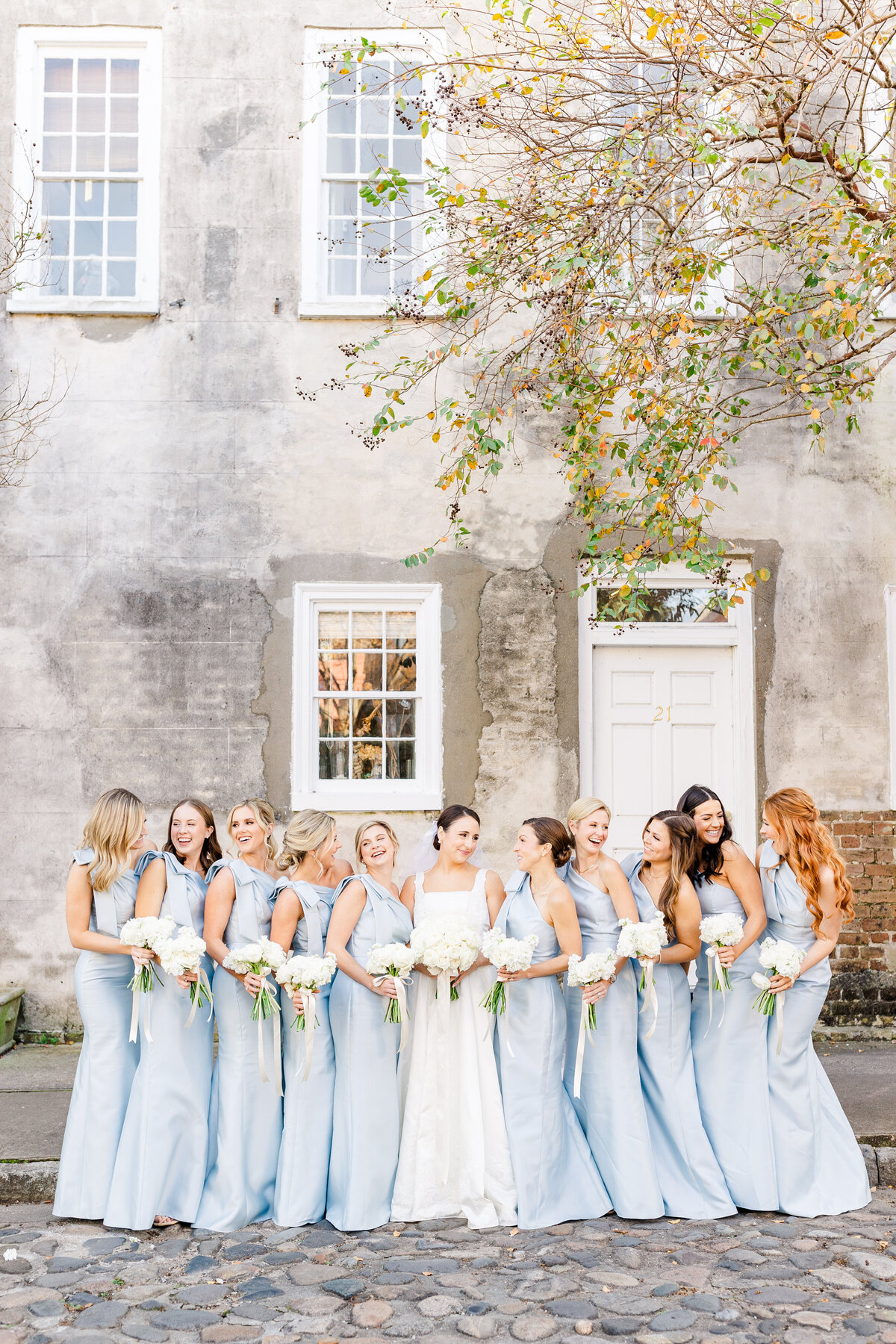 bride standing with bridesmaids in blue at SC wedding
