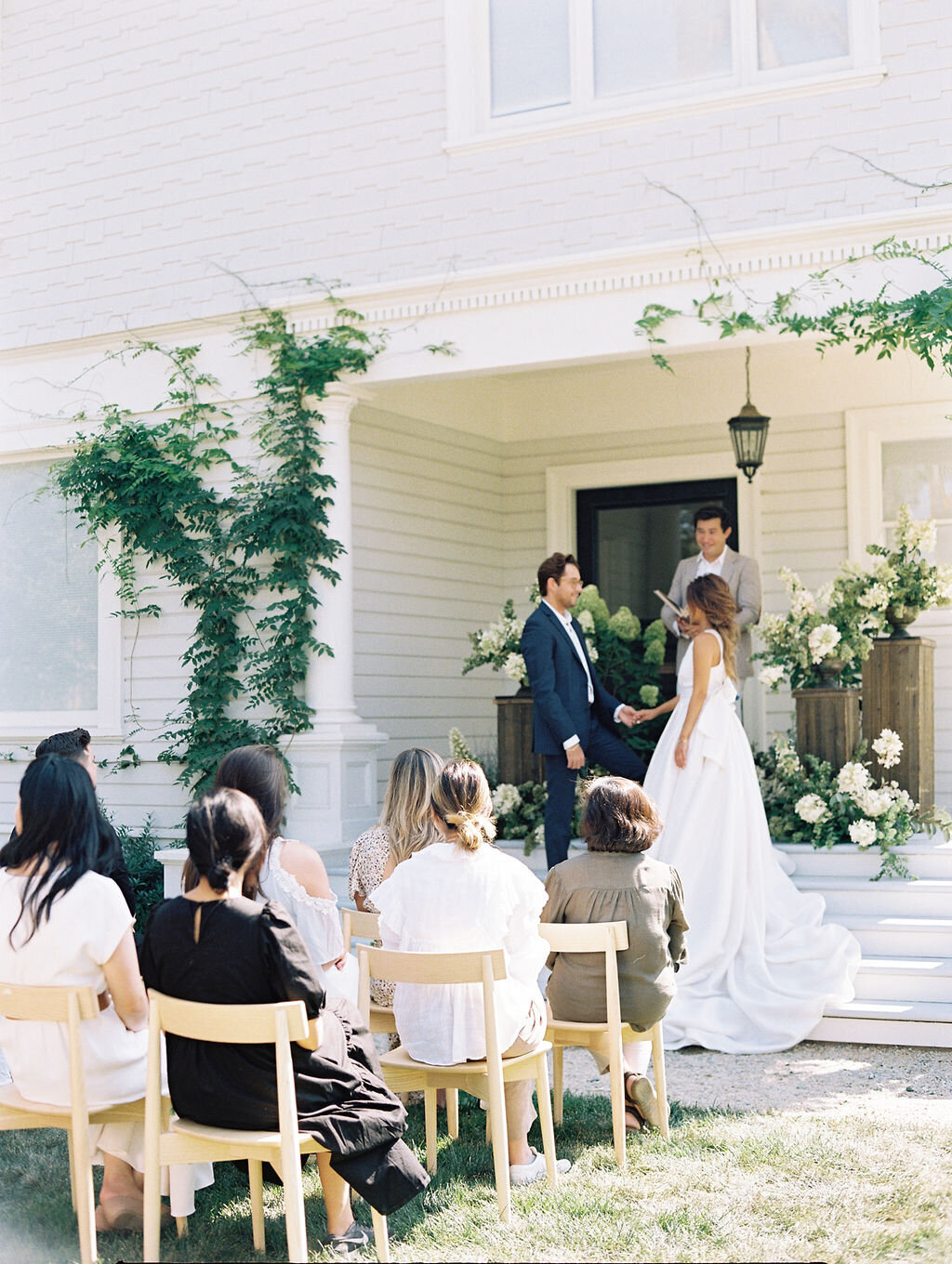 wedding ceremony with guests at house