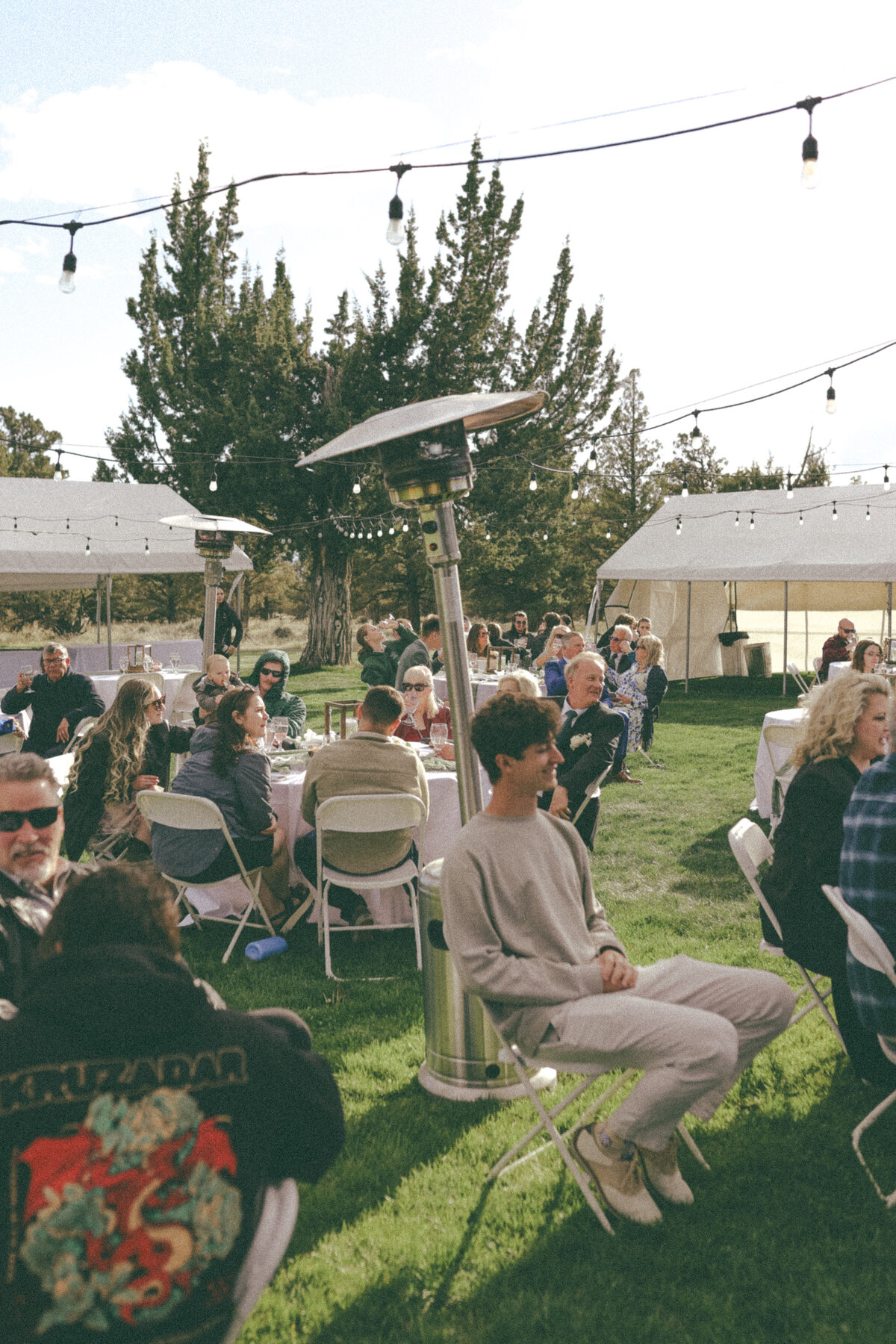 Guests Gathering at Outdoor Wedding Reception | Candid Oregon Wedding Photographer