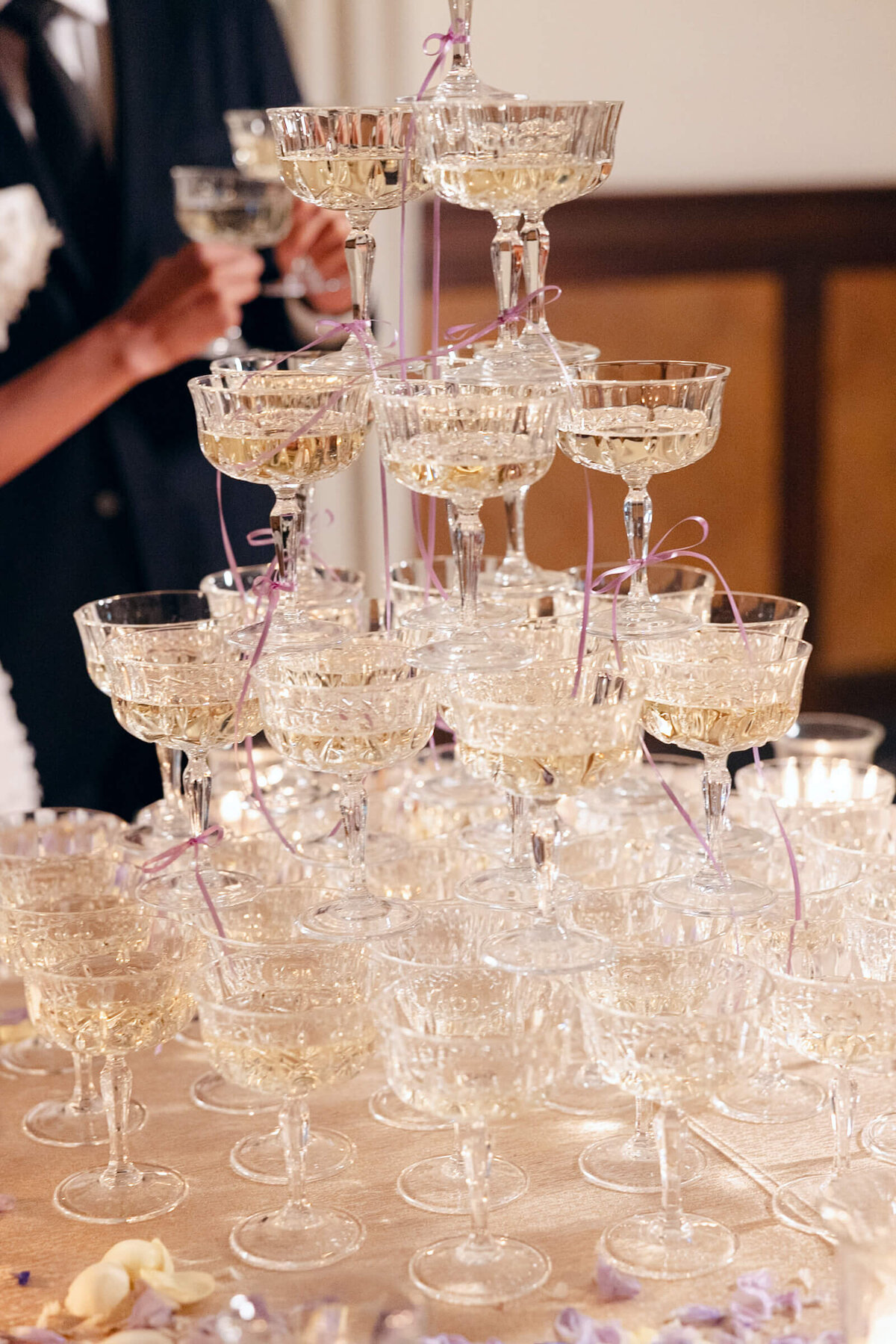 A wedding day photo the couple at their champagne tower at Villa Aura del Lago on Lake Como in Italy
