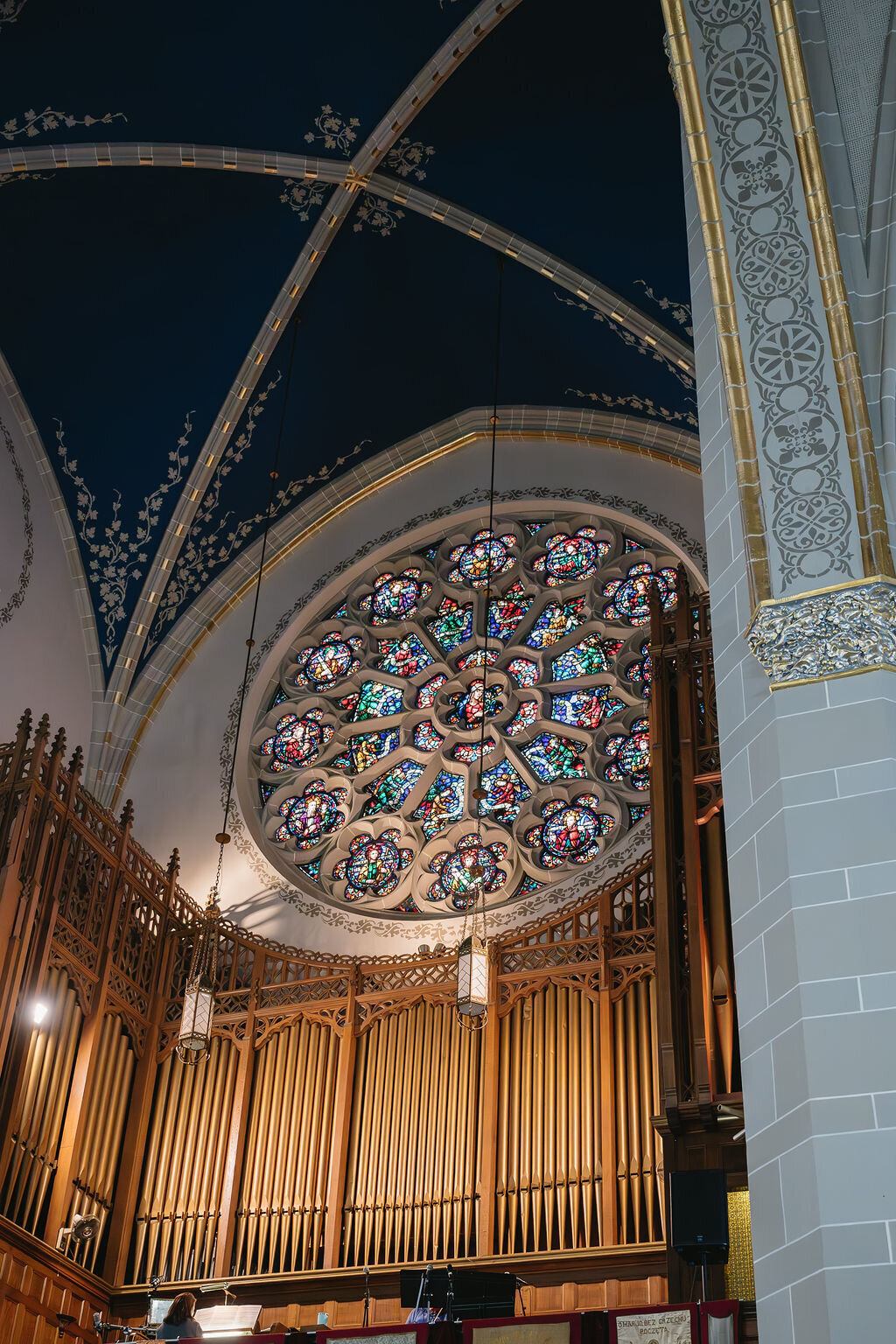 detailed stained glass window in Michigan Catholic church