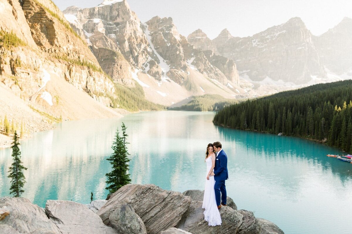 Moraine-Lake-elopement-photograph-with-a-bride-and-groom-holding-each-other-during-their-portrait-shoot