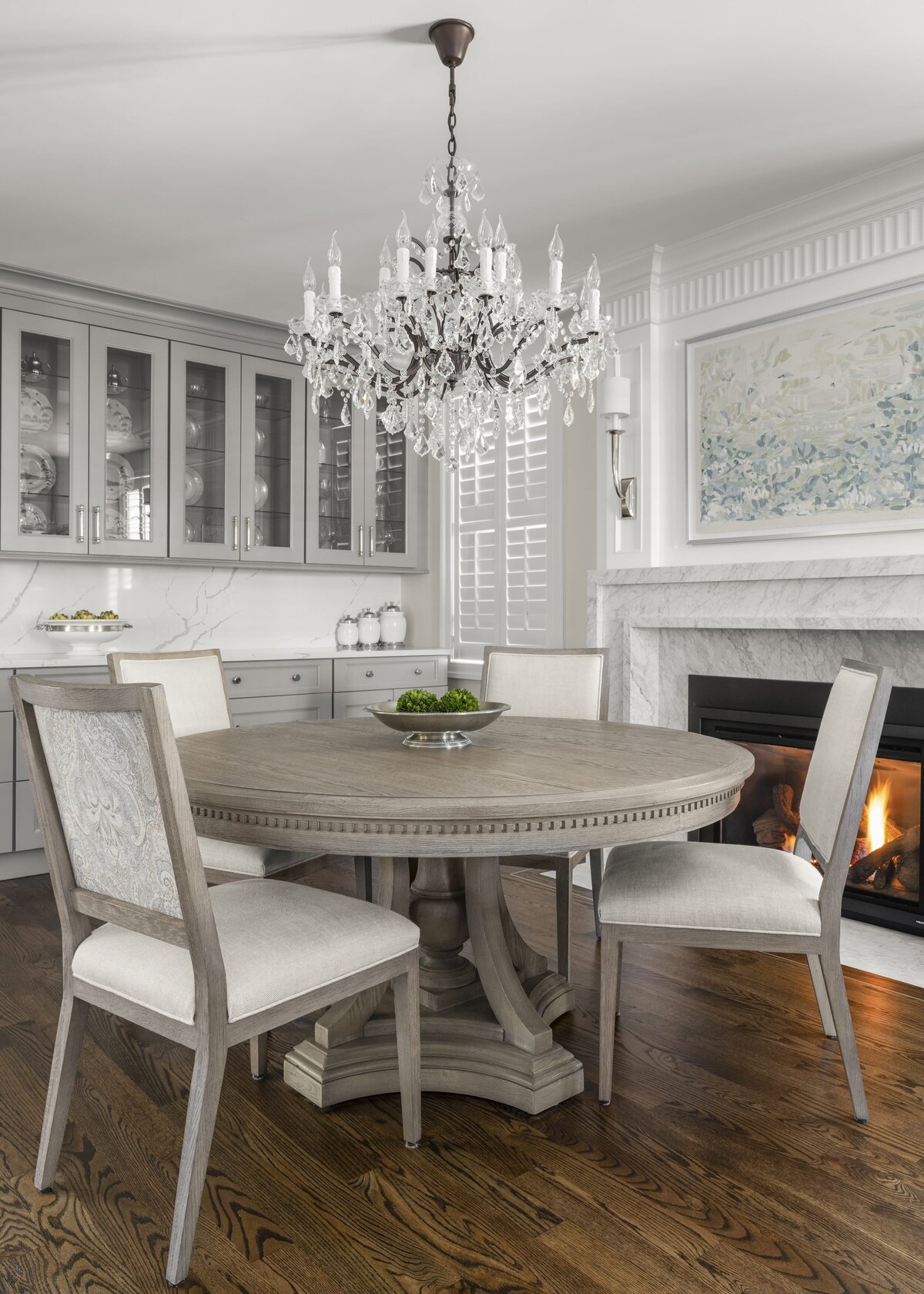 candra lynn interiors ocean port project round dining room table with chandelier 