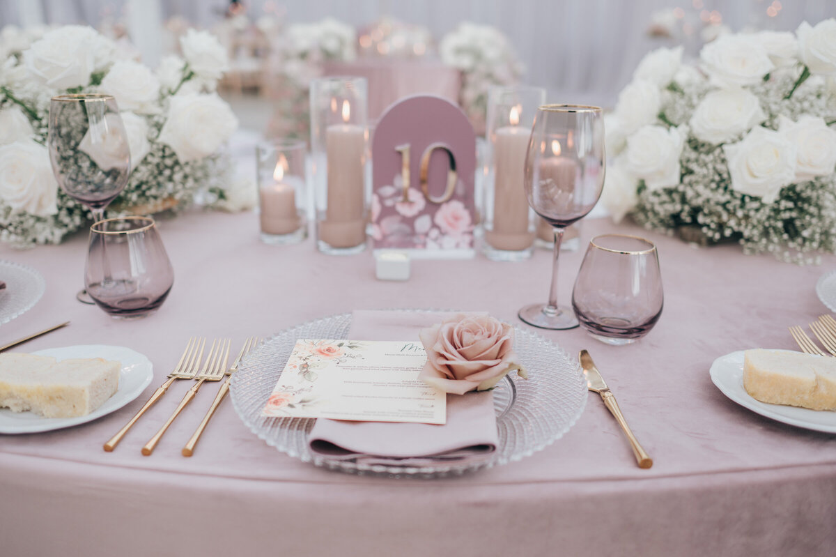 Romantic blush and lavender tableware for luxurious indoor wedding