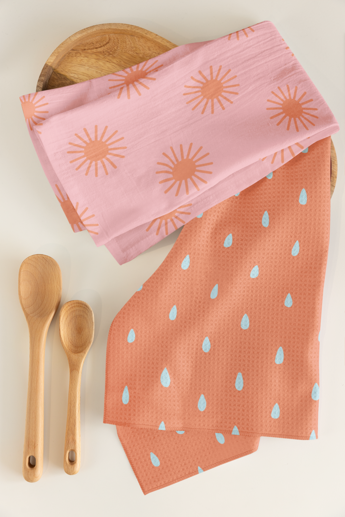 mockup-of-a-tea-towel-and-microfiber-tea-towel-placed-next-to-two-wooden-spoons-m40745