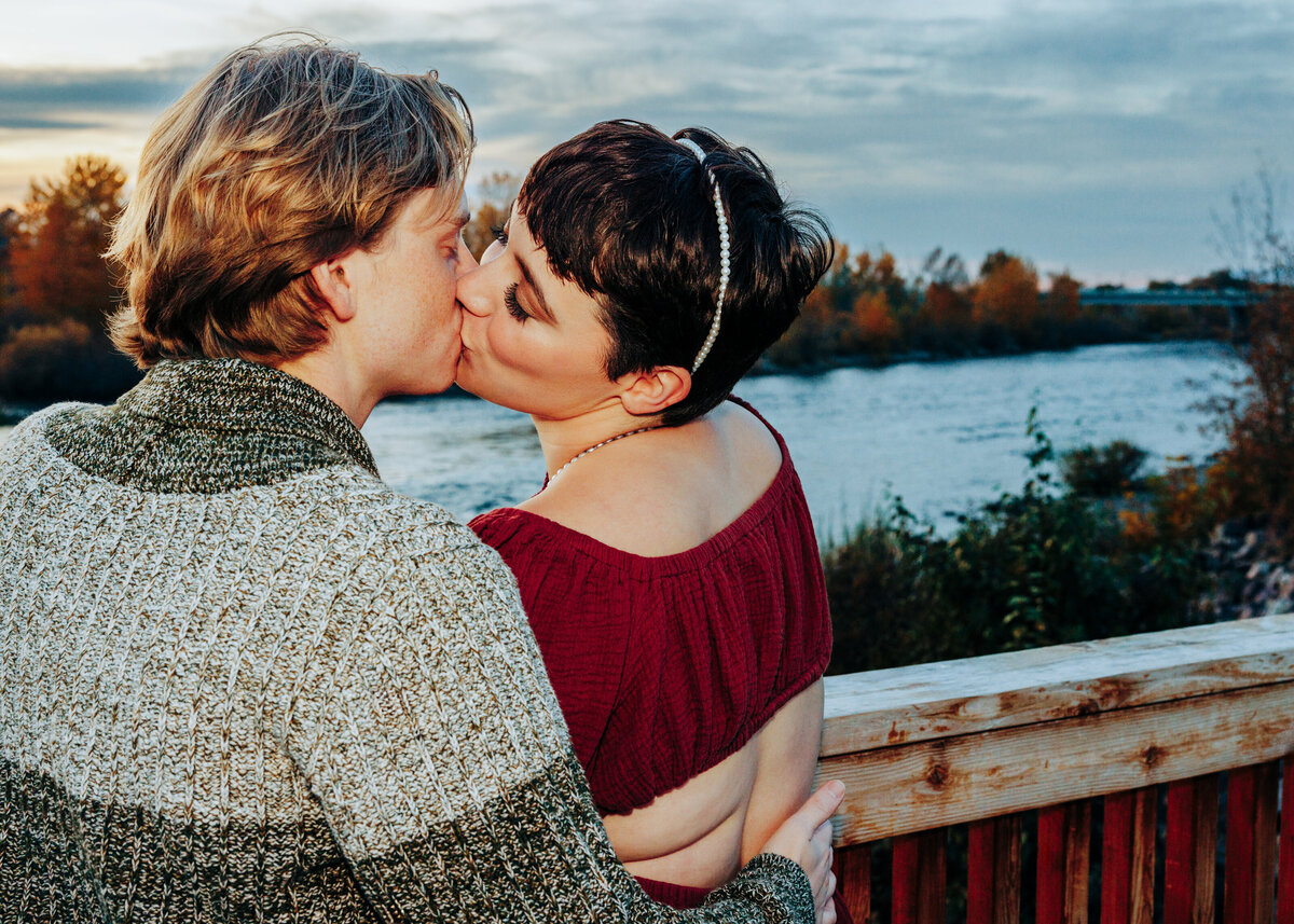 Engagement photo couple kissing at Caras Park in Missoula