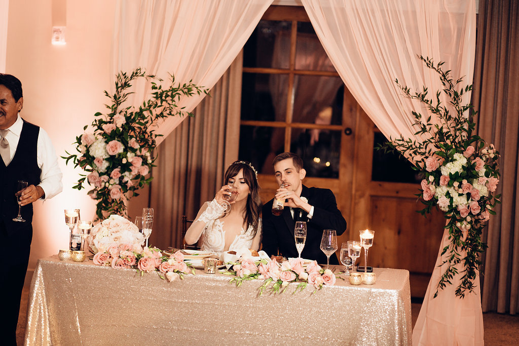 Wedding Photograph Of Bride And Groom Drinking From Their Wine Glasses Los Angeles