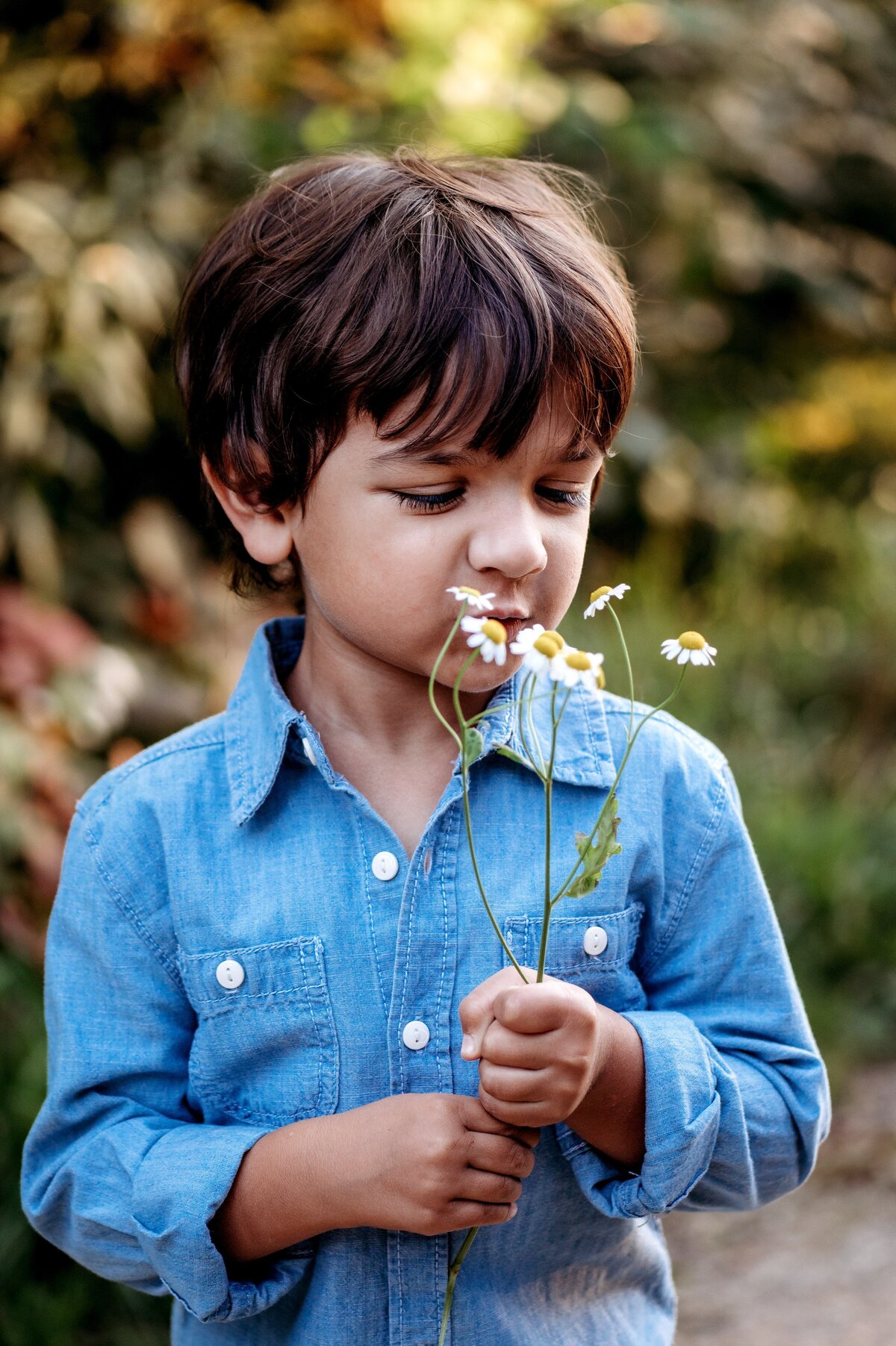 Child blowing flowers McKennaPattersonPhotography