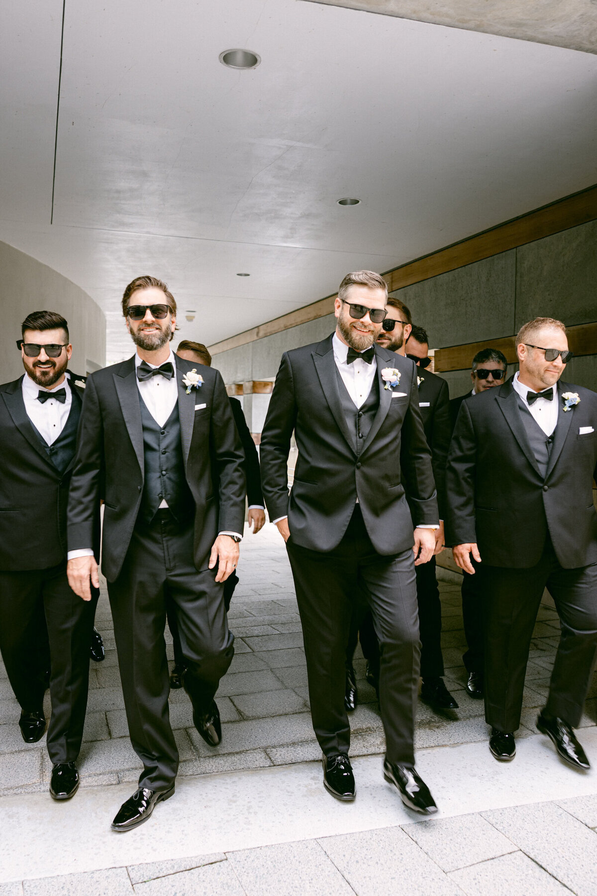 A wedding day photo of the groom and his groomsmen at Crystal Bridges Museum of American Art in Arkansas