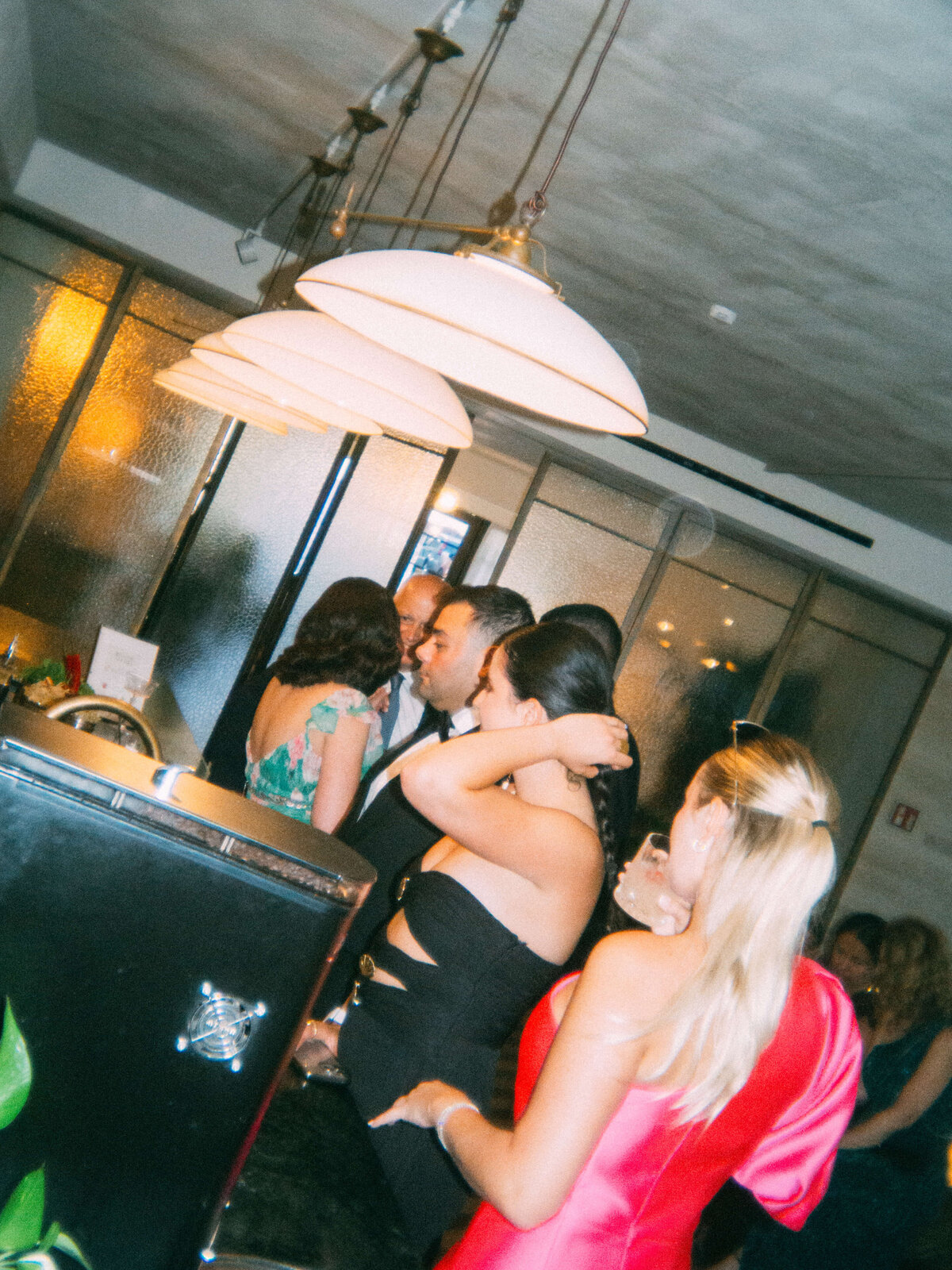 Stylish ceiling lights in wedding reception space at Soho House Rome

