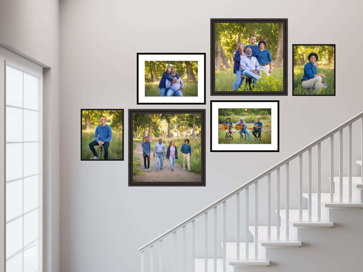 collection of framed portraits of a family hanging on a wall above a set of stairs in a home in Pueblo, CO