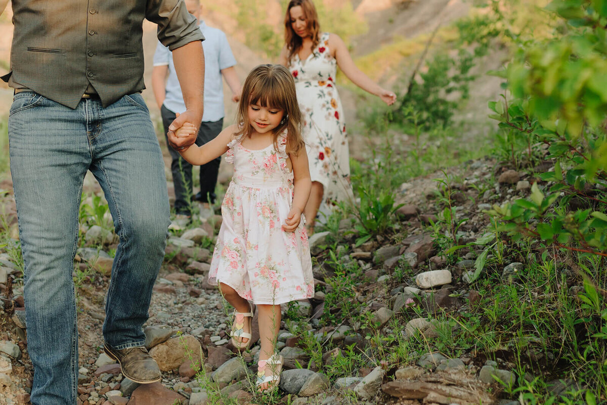 Family walking along beach at family with two kids on the beach at family photo shoot in Finger Lakes, NY
