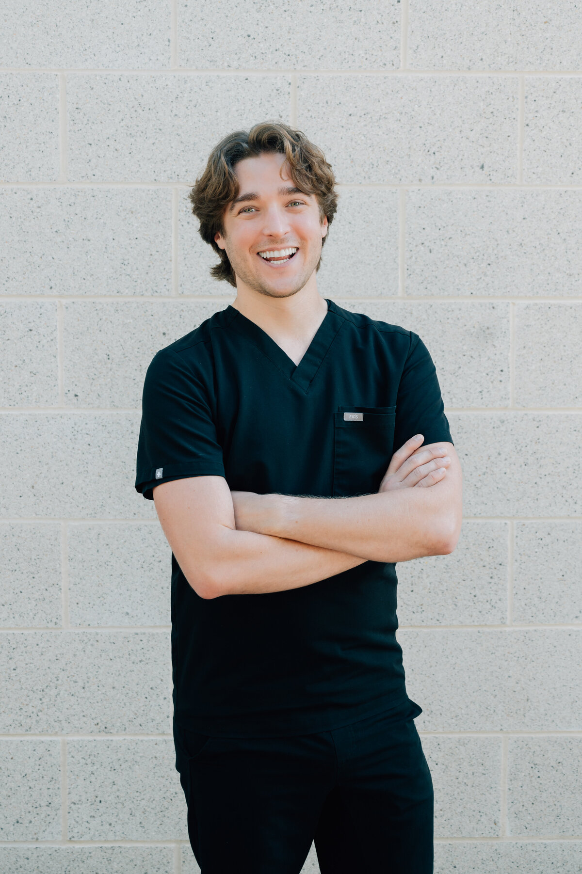 Headshot of Montrose in front of white wall, Houston brand photo