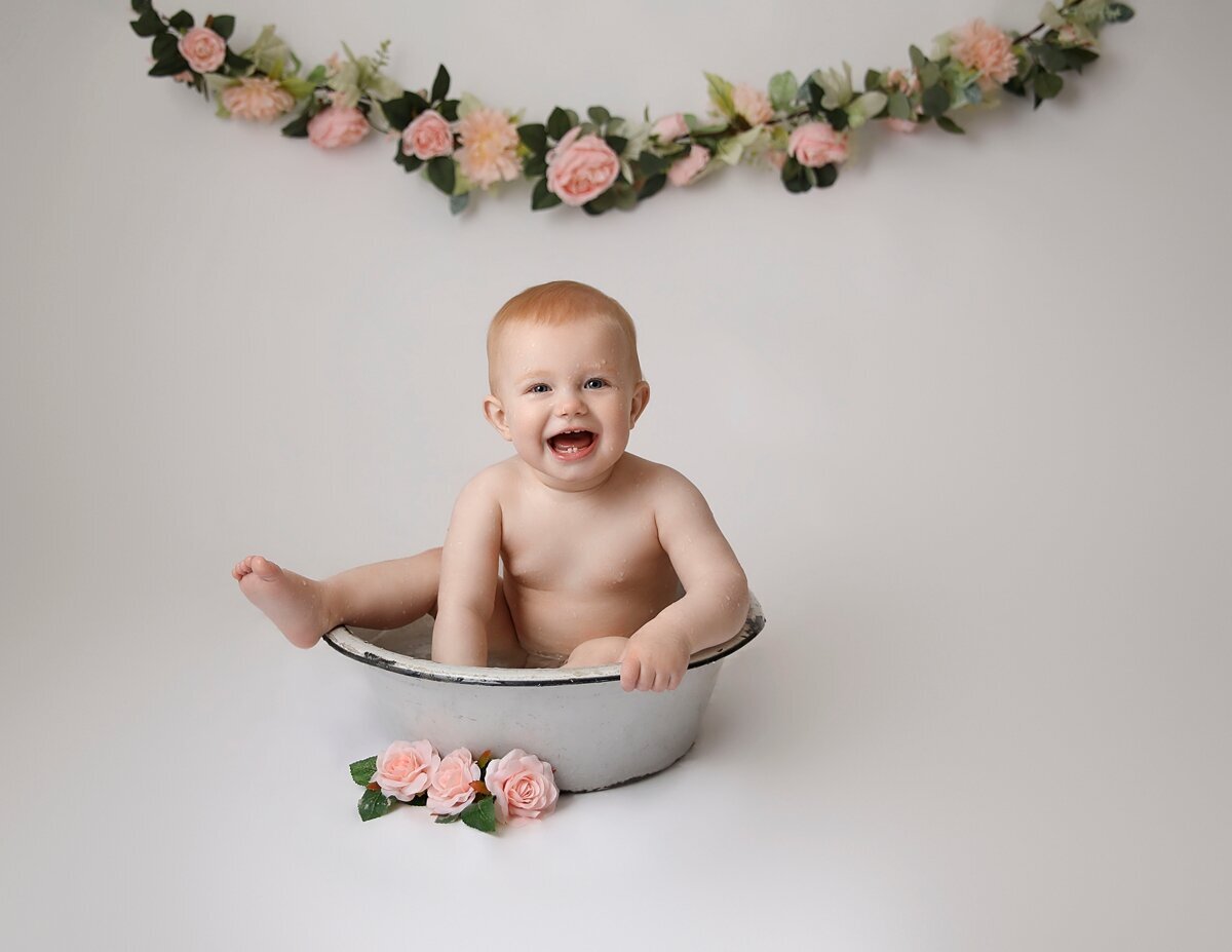 1 year old girl in a  bowl