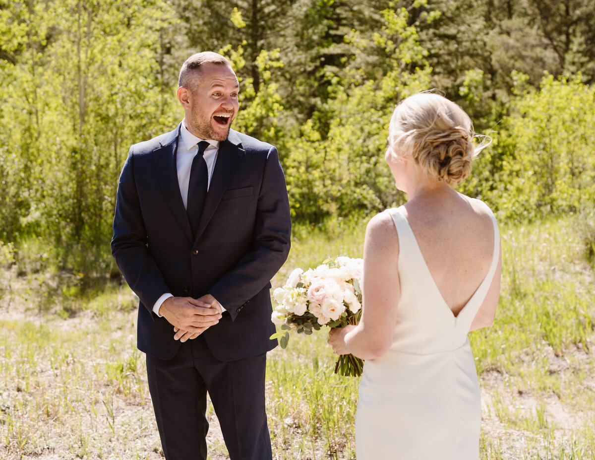 Bride and groom share a first look in an aspen grove during their Frisco, Colorado elopement.