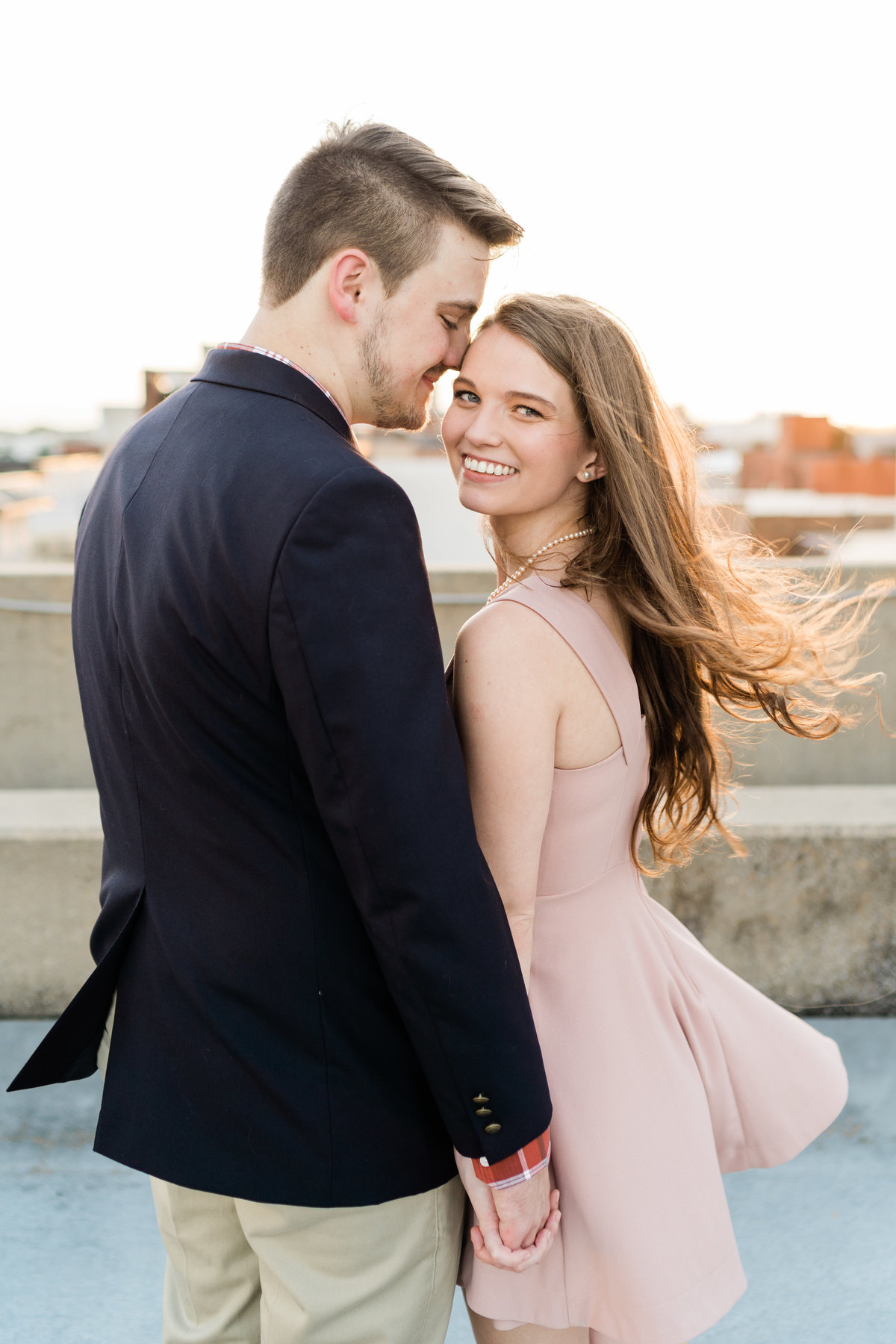 Couple smiling at each other during engagement photoshoot in Alabama