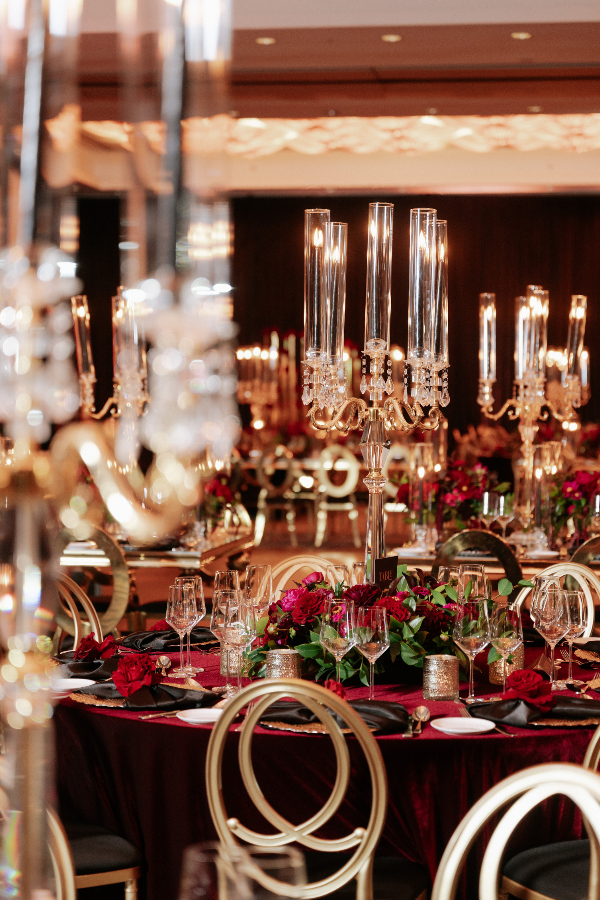 black-gold-pink-burgundy-wedding-reception-crystal-candelabra-chairs-red-roses