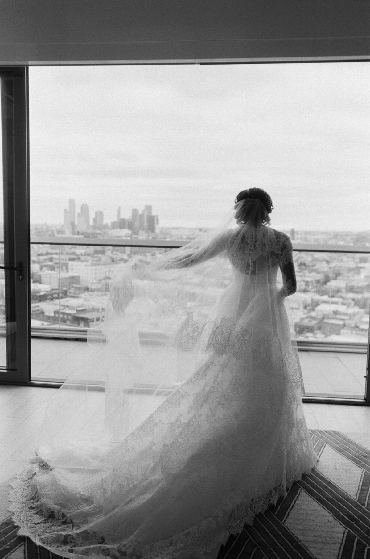 bride in wedding dress and veil at william vale hotel in brooklyn new york