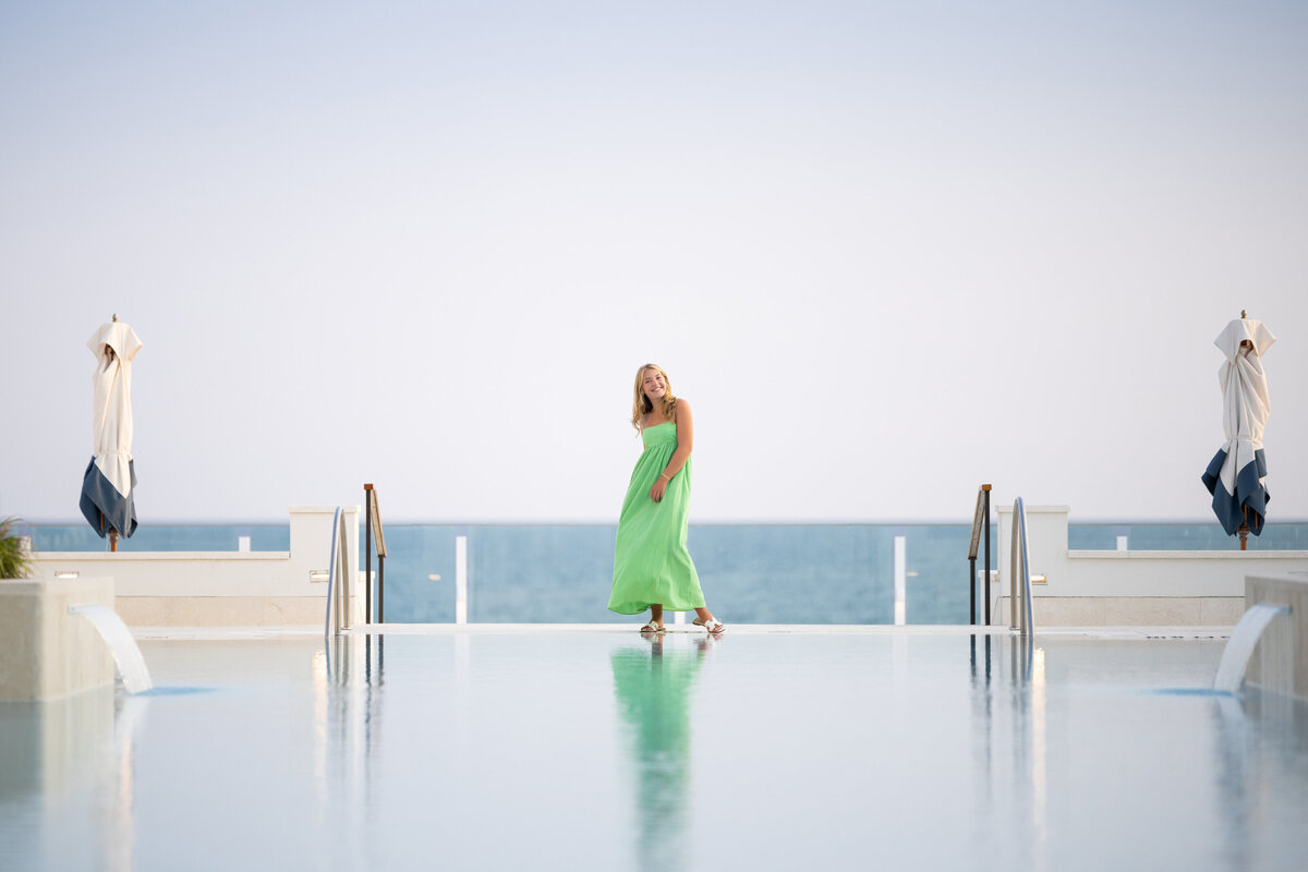A girl at the edge of a pool