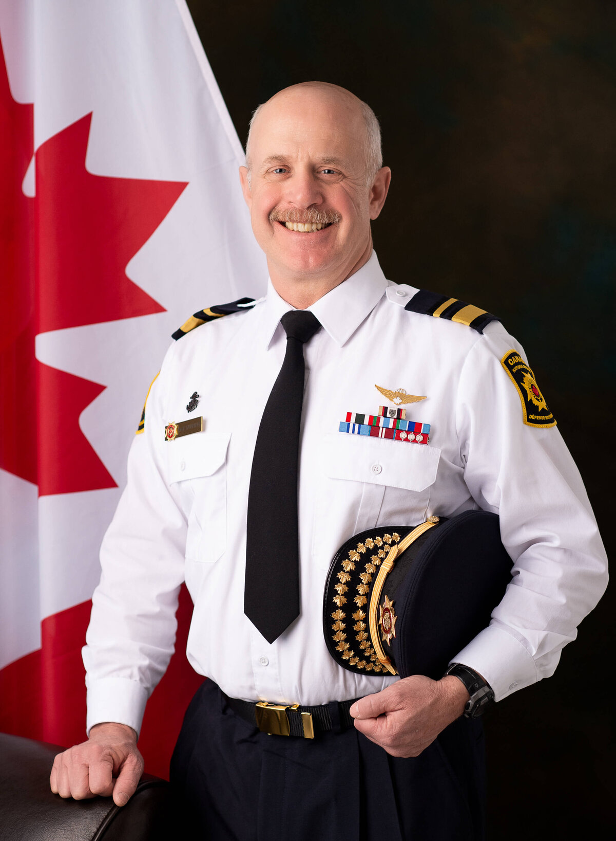 a formal portrait of a firefighter in uniform taken in studio by Ottawa headshot photographer JEMMAN Photography
