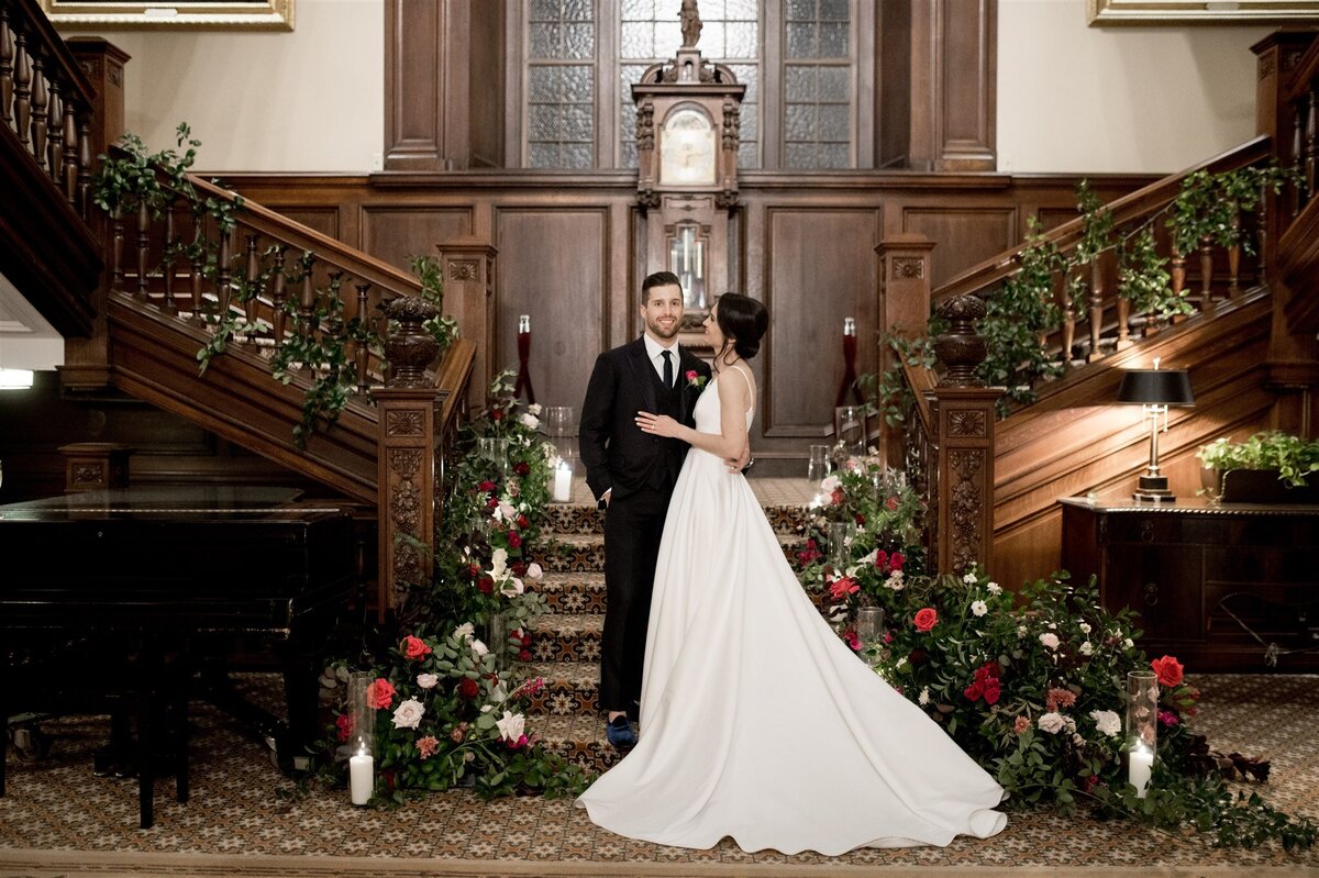 Kate-Murtaugh-Events-Back-Bay-Boston-wedding-floral-staircase-bride-groom
