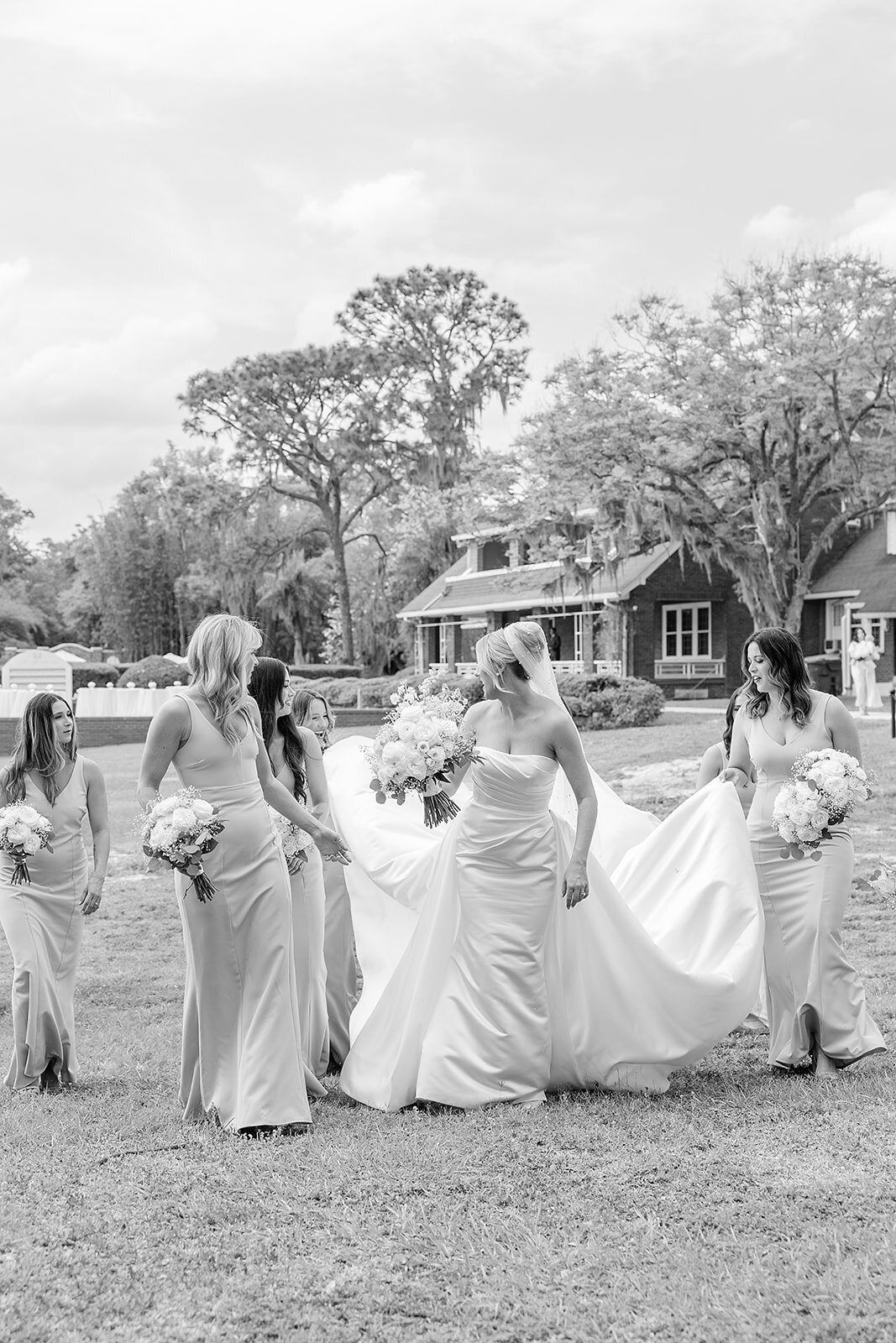 Bride walking with her bridesmaids 