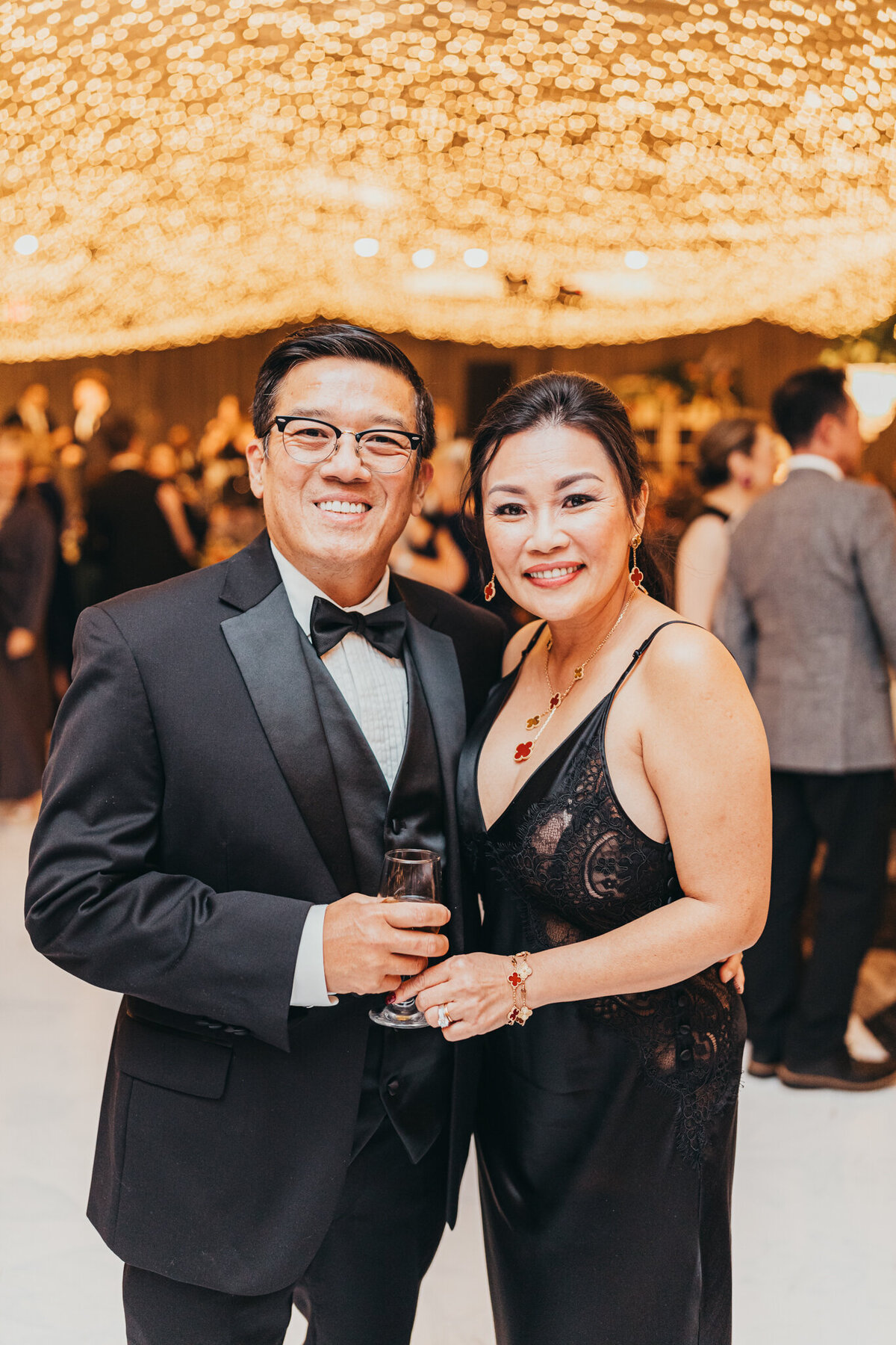 friends look at camera for a posed picture during reception