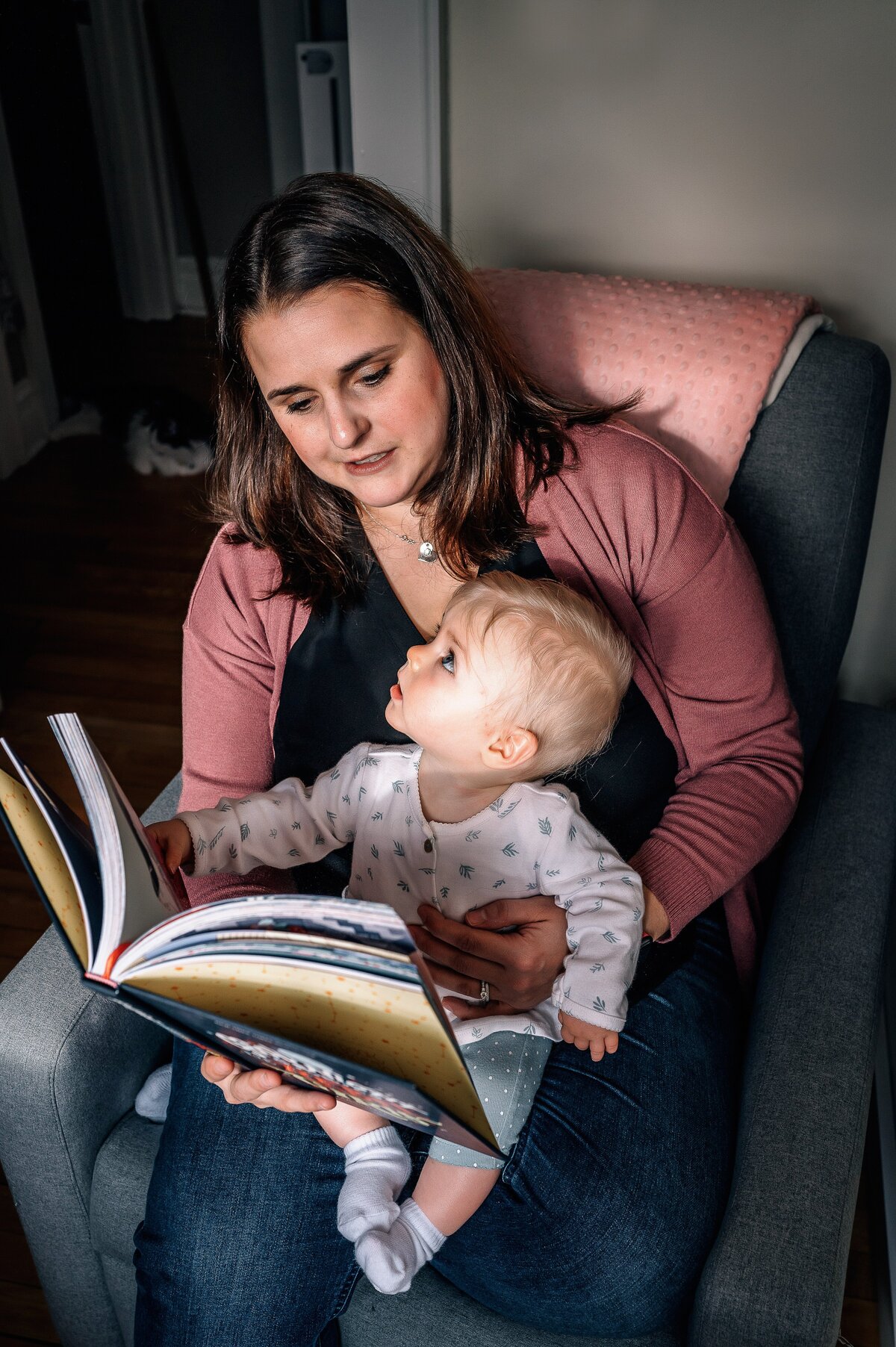 Mom and baby reading McKennaPattersonPhotography
