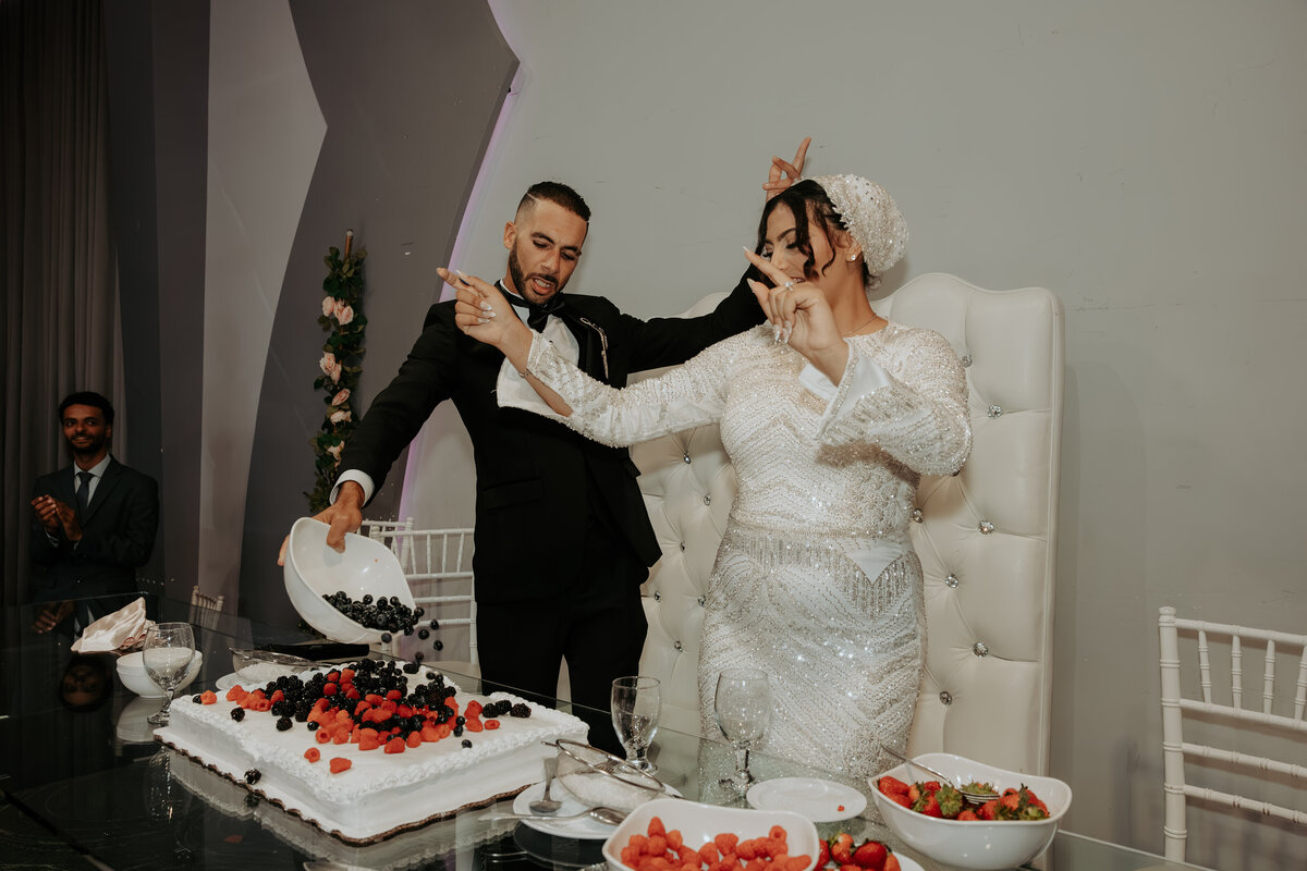 Playful Cake Celebration at Arabic Wedding in Los Angeles – Bride and Groom Having Fun