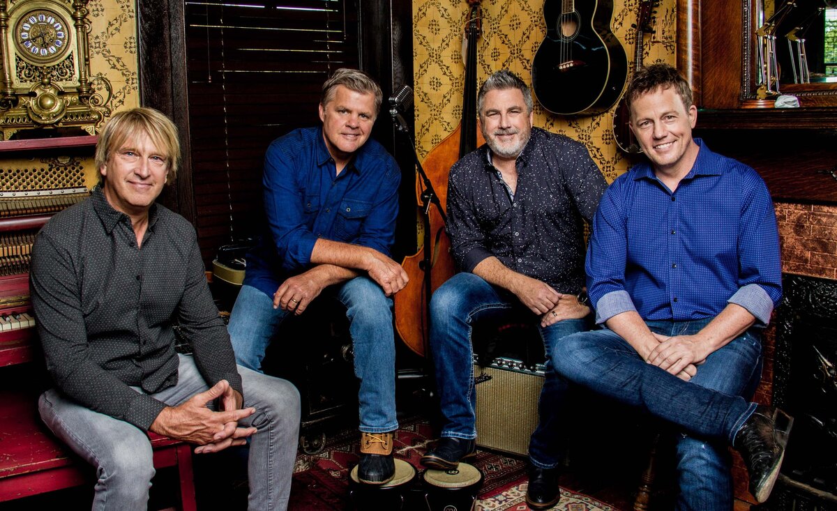 Country band photo Lonestar sitting with vintage instrument behind
