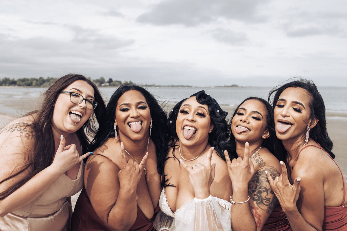 a bride being silly with her bridesmaids