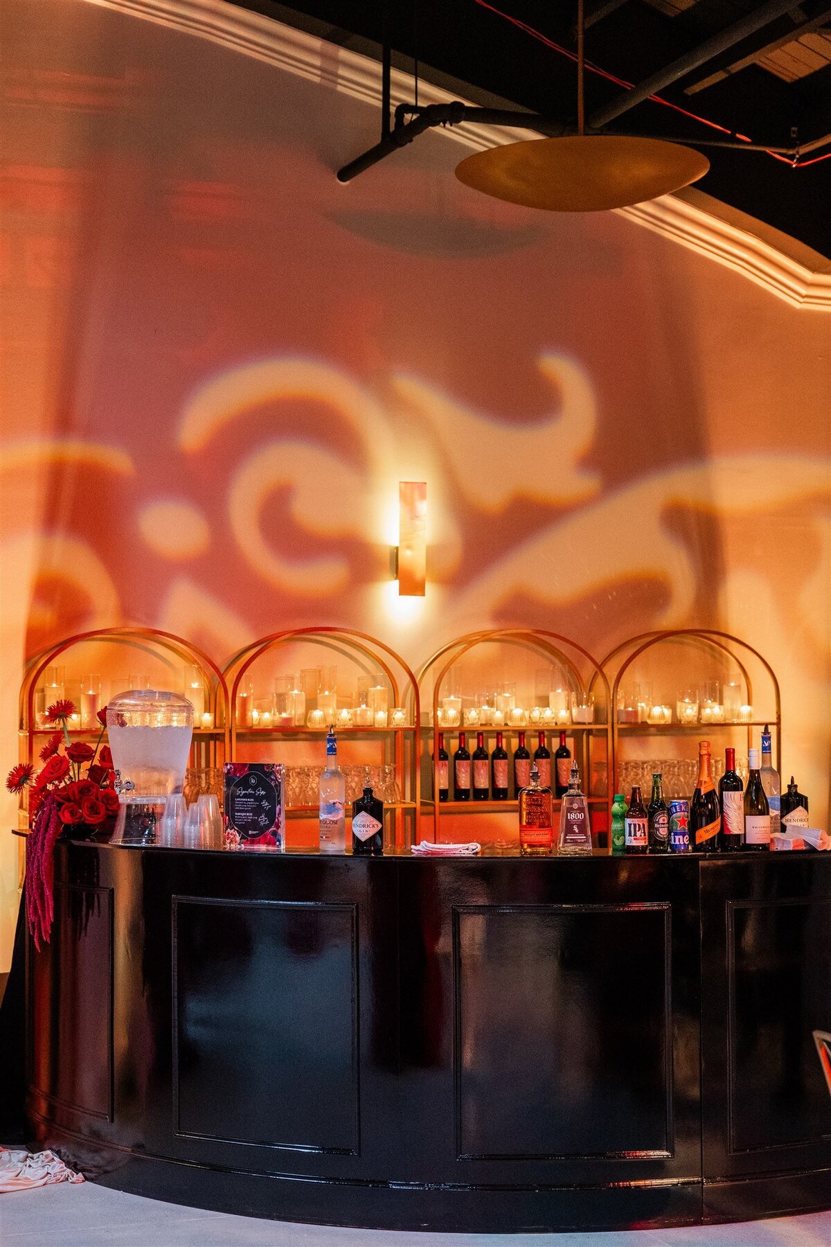 Event space styled with a Baroque theme, featuring ornate gold accents, rich fabrics, grand chandeliers, and intricate moldings, creating a luxurious and dramatic atmosphere