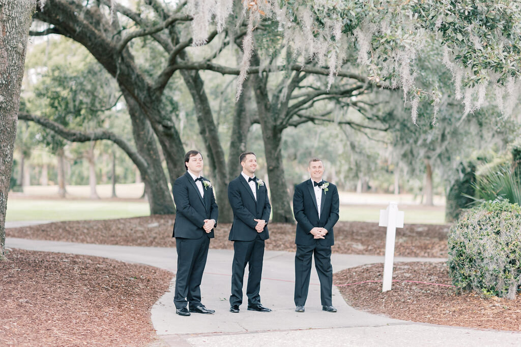 Charleston Wedding Photographer | Photo of groom and groomsmen waiting at wedding ceremony space