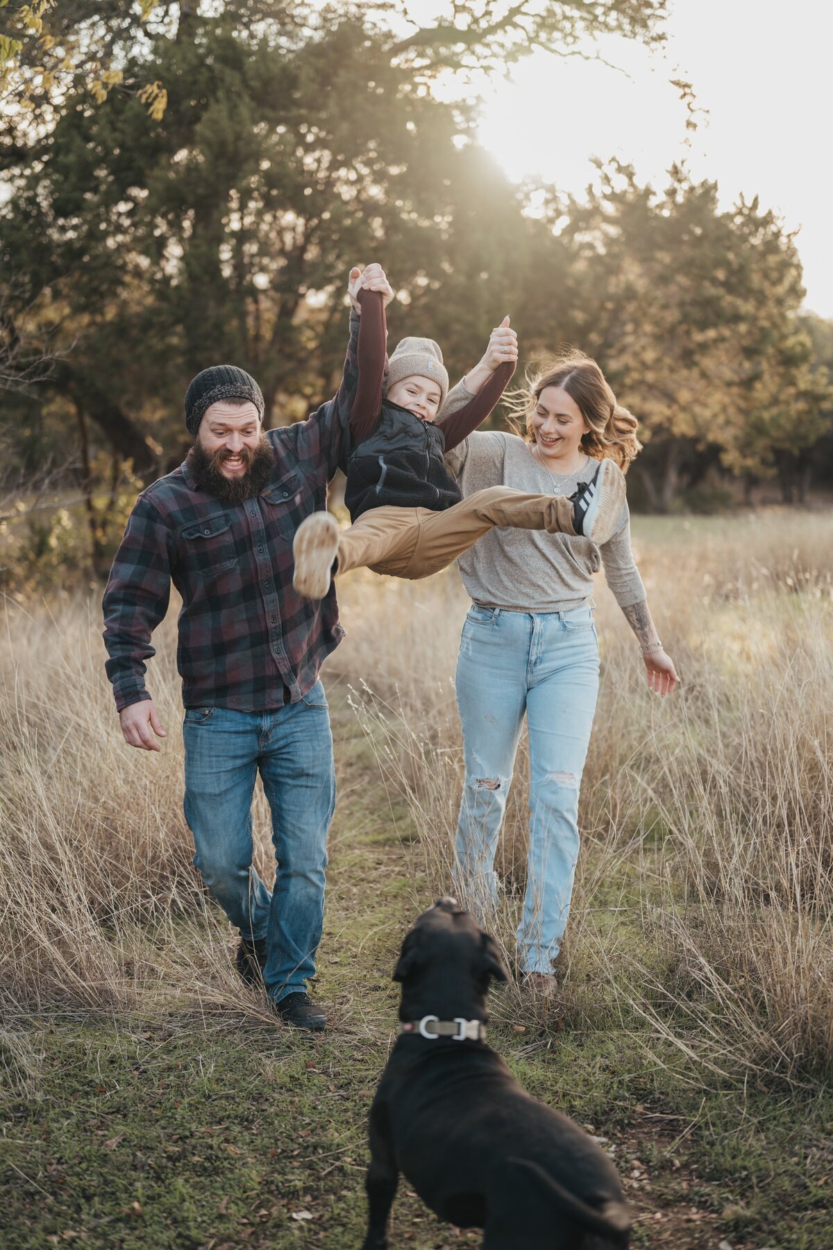 parents-throwing-kid-in-air