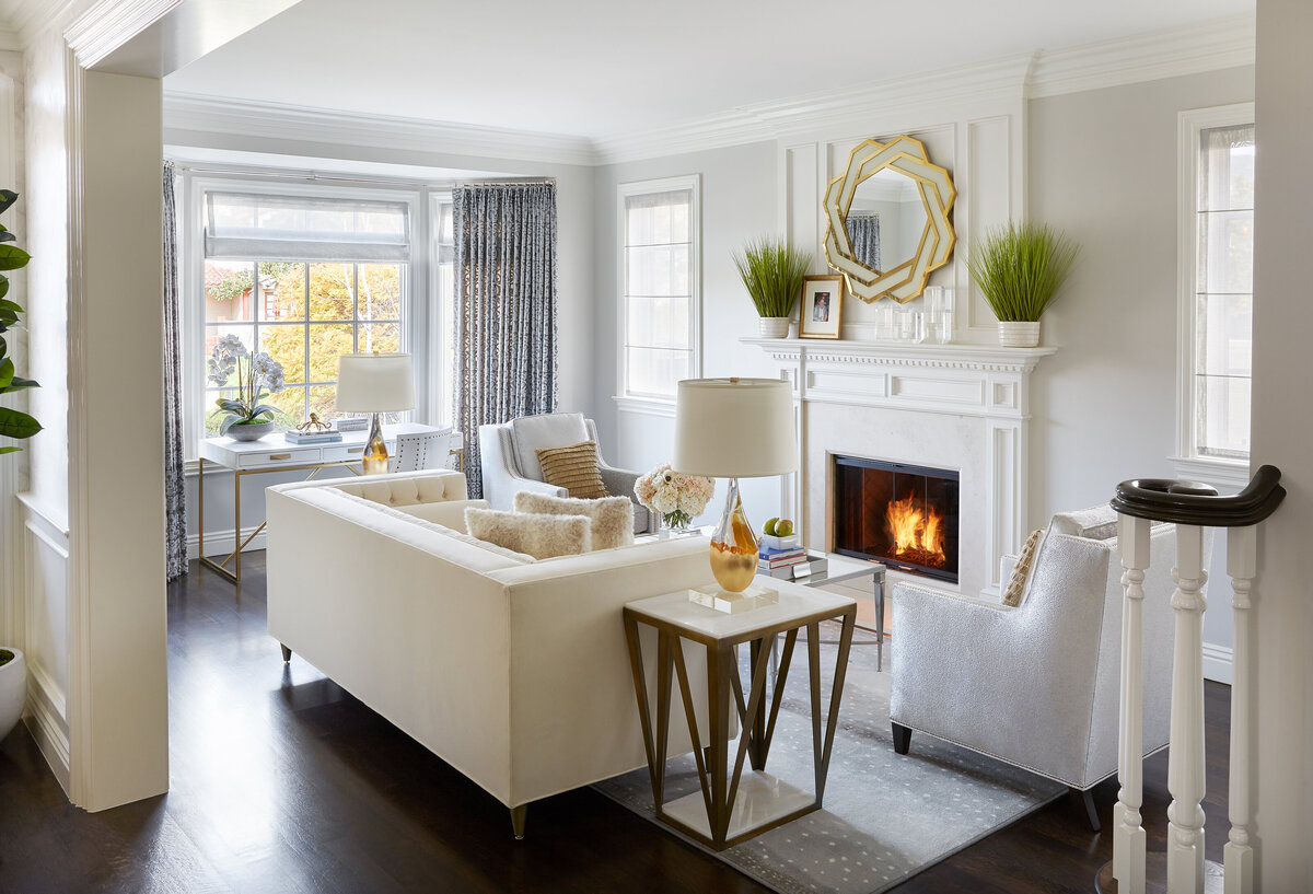 Modern White Formal Sitting Room With Wooden Side Table and Fire Place