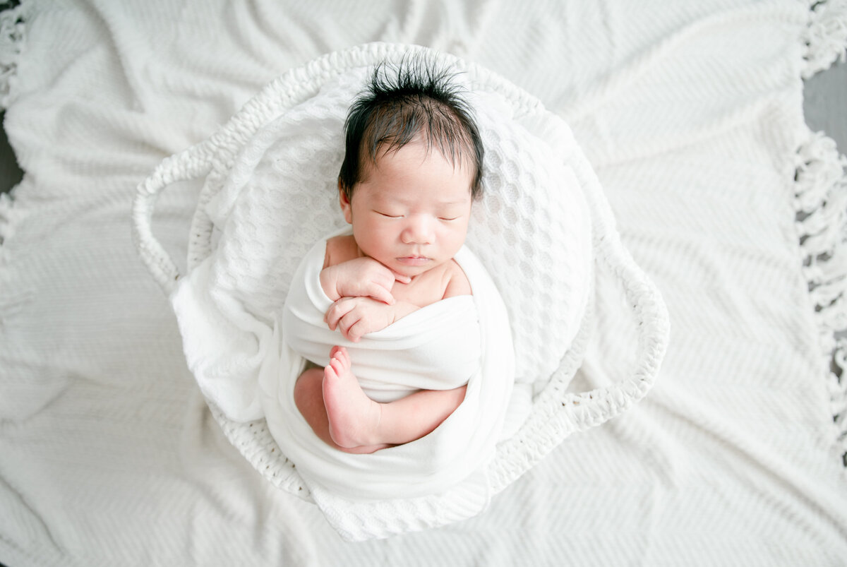 baby in baskets