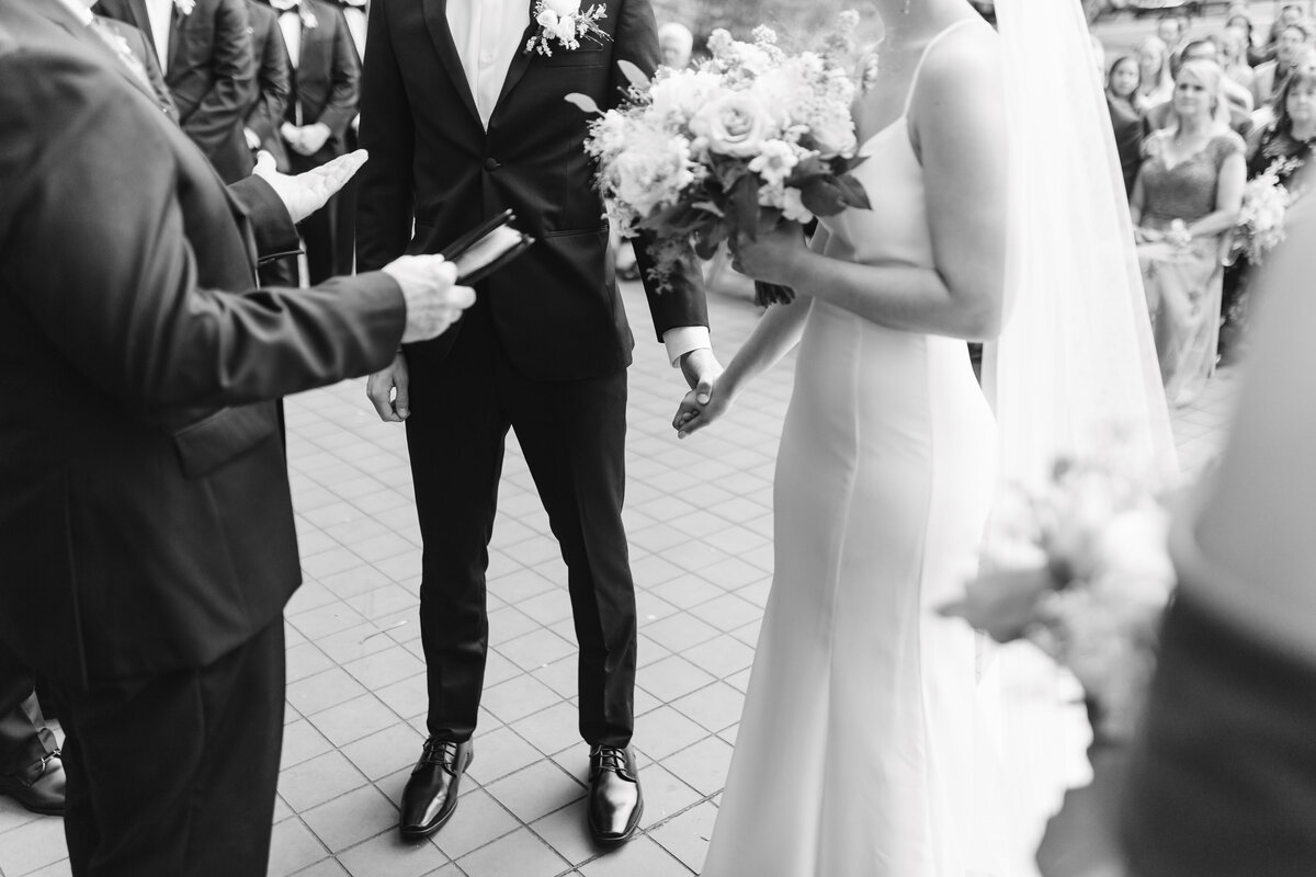 bride and groom standing at the altar
