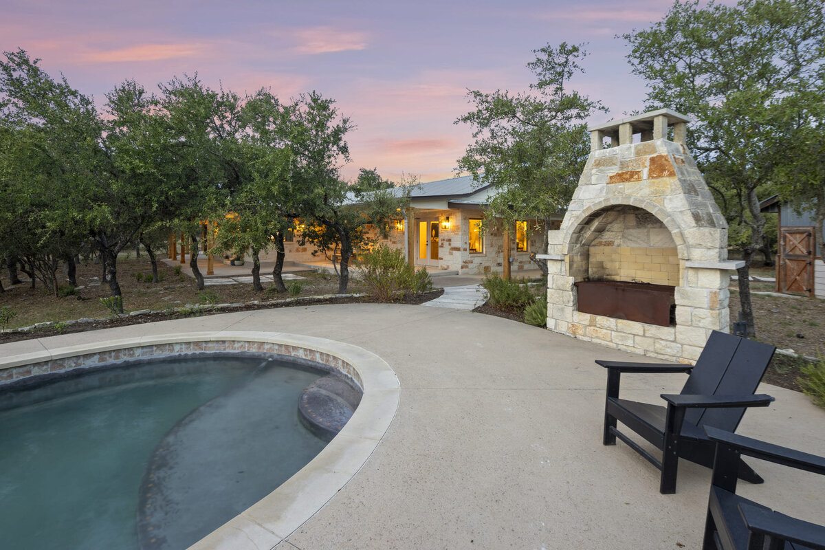 outside pool with fireplace in Wimberley Texas
