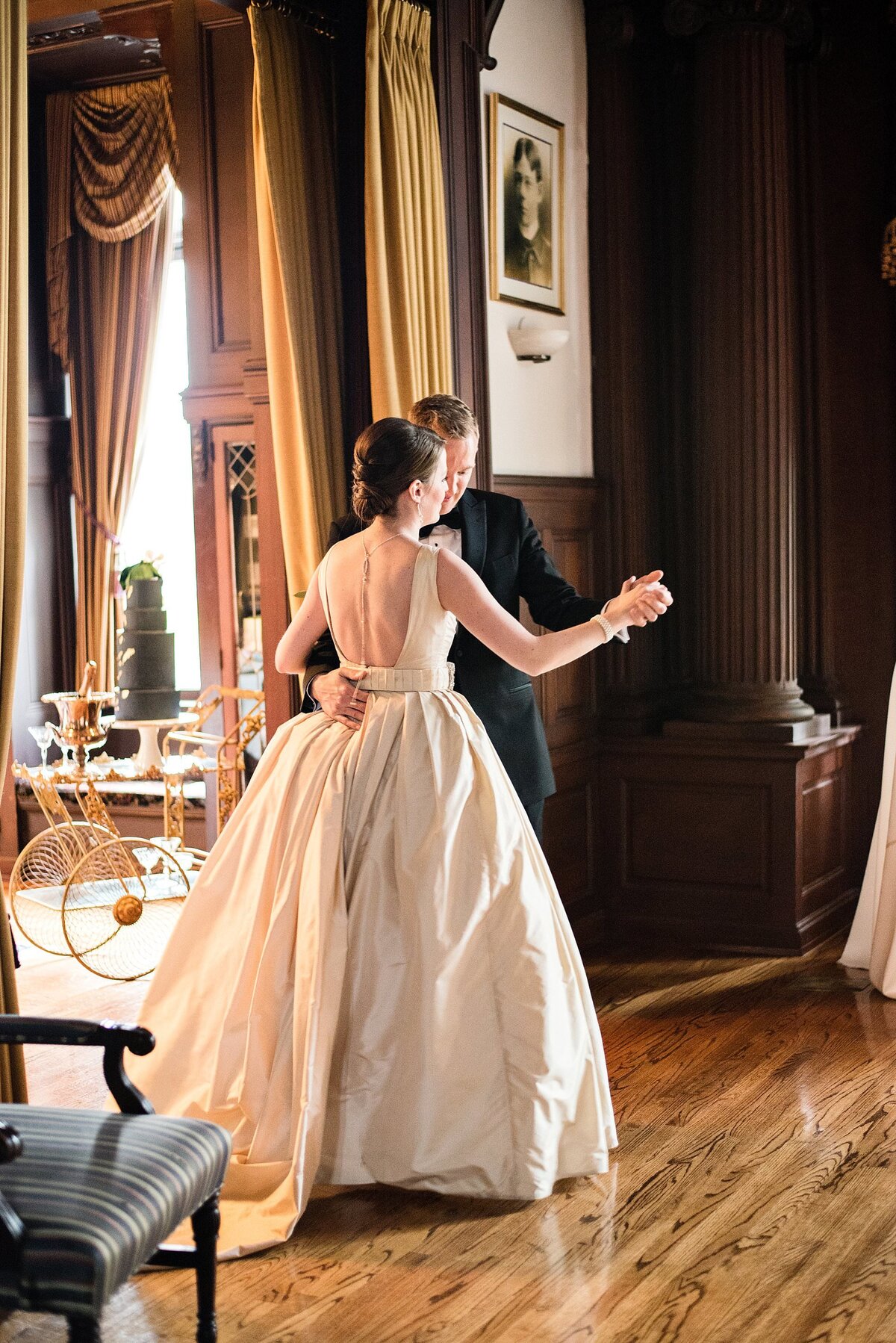 Couple sharing a romantic dance inside historic home