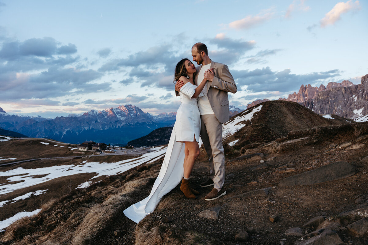 romantic couple during twilight elopement in Dolomites