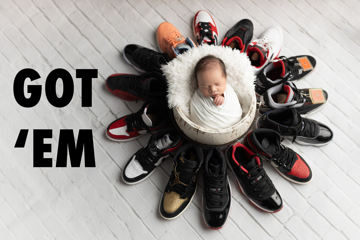 Creative Dallas newborn photographer image featuring a baby surrounded by sneakers with bold “Got 'Em” text, perfect for stylish baby portraits.