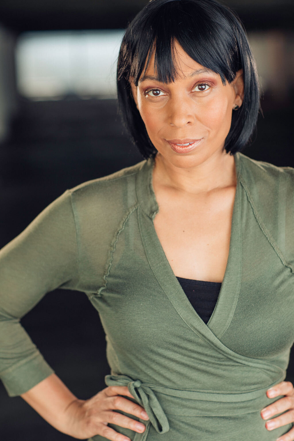 Headshot Photograph Of Woman In Green Blouse And Inner Black Tank Top Los Angeles
