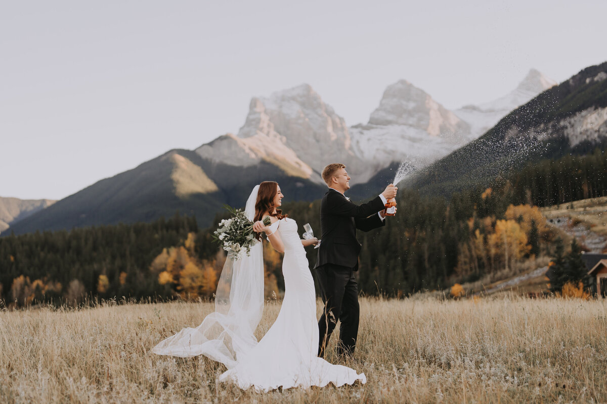 Eloping couple on top of a mountain at Rockies Heli Alberta