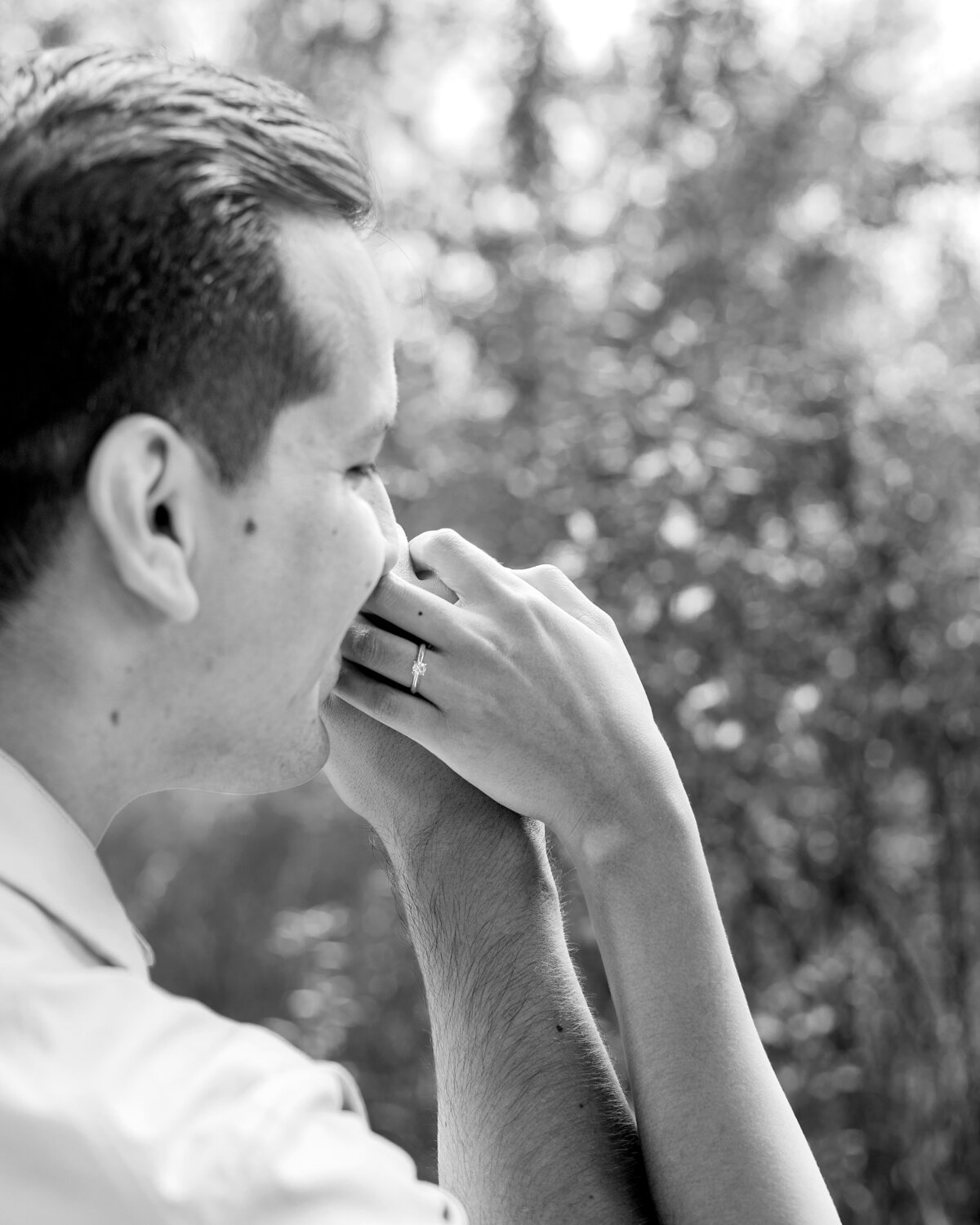 kissing-fiances-ring-hand-bw
