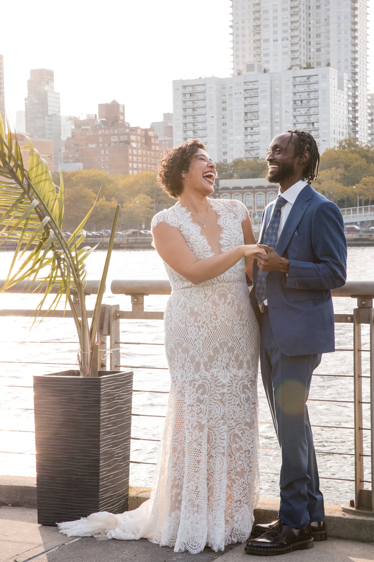 Candid moment of inter-racial young wedding couple enjoying a moment together.