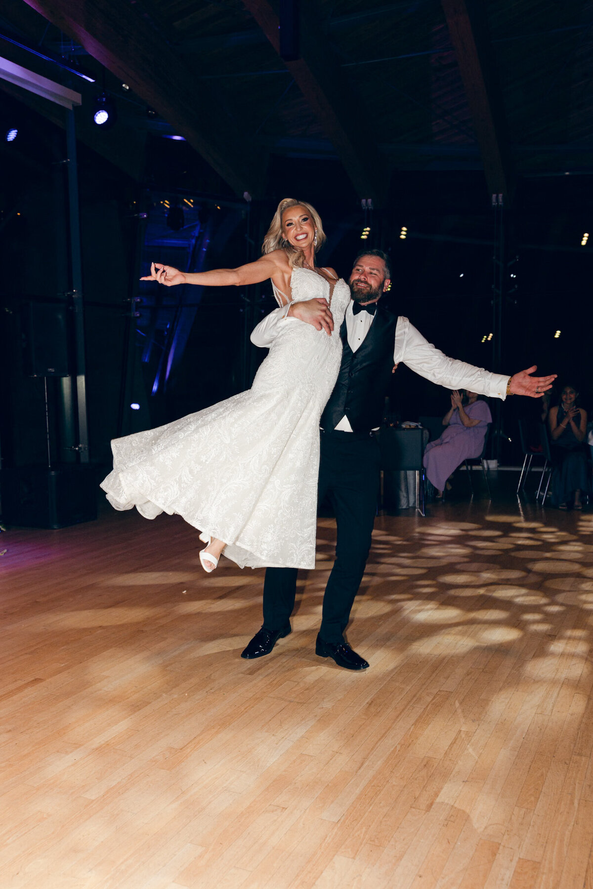 A wedding day photo of the bride and groom during their first dance at cRYSTAL bridges Museum of American Art