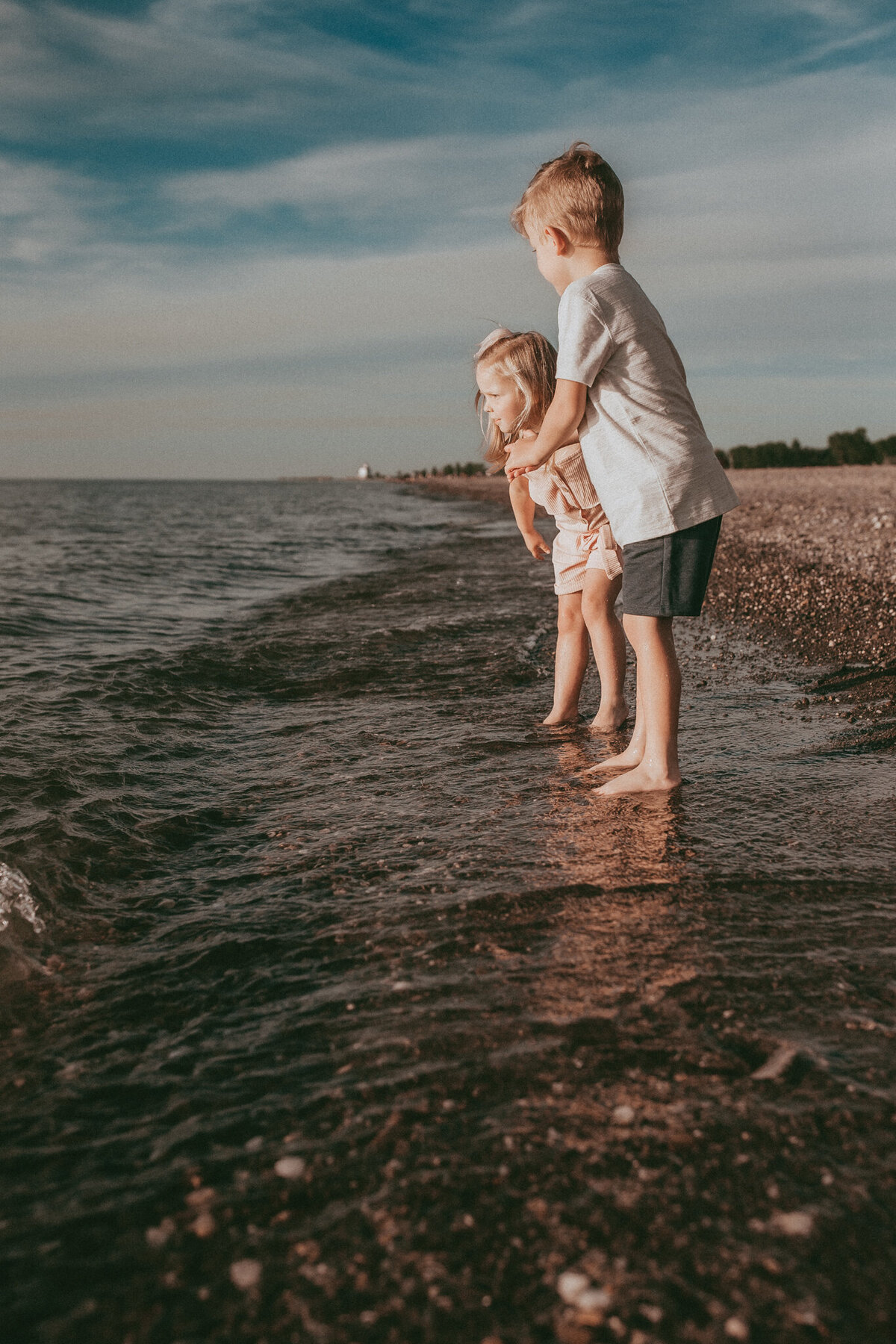 kids throwing rocks at the beach