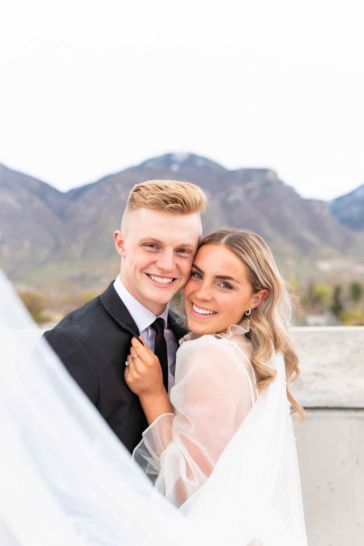 Bride and groom smiling together on their elopement day in Colorado