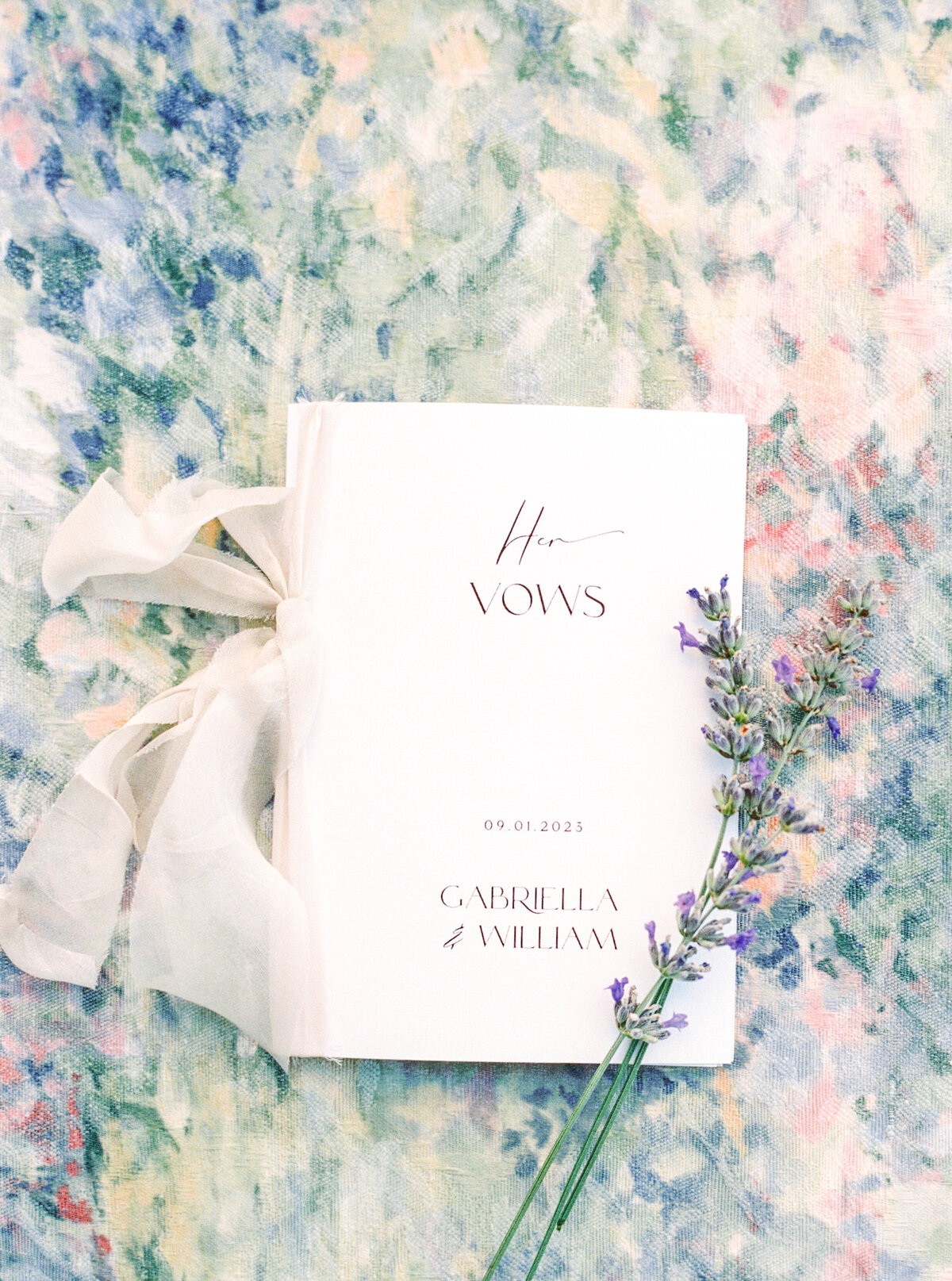 Film photograph of vow book and lavender photographed by Italy wedding photographer at Villa Montanare Tuscany wedding